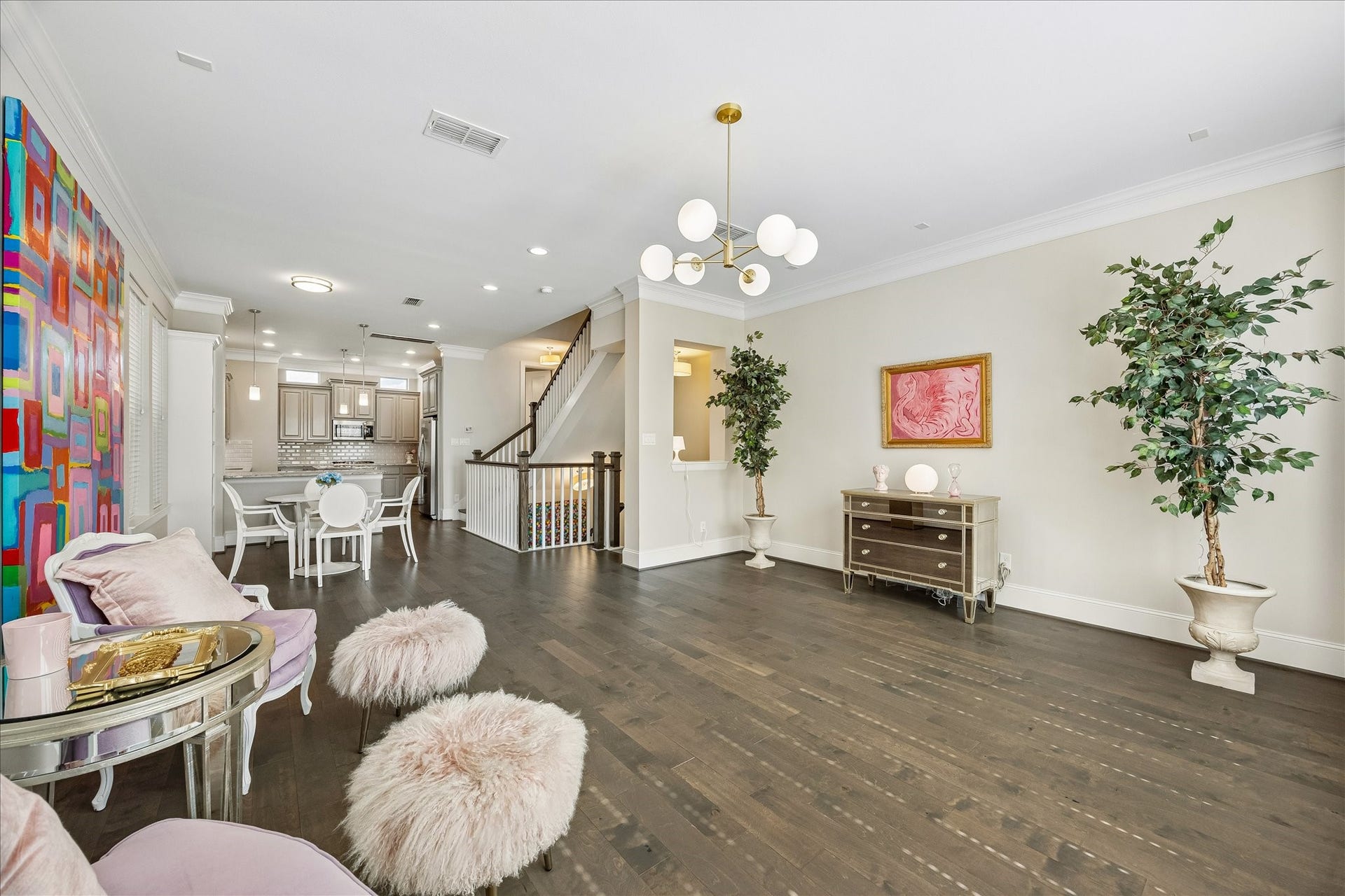 Beautiful view showcasing the expansive living room & seamless open sightlines throughout the 2nd floor. Generous proportions allow for a variety of furniture arrangements while maintaining excellent flow to adjacent dining & kitchen spaces. A wonderful gathering area combining comfort, functionality & abundant natural light!