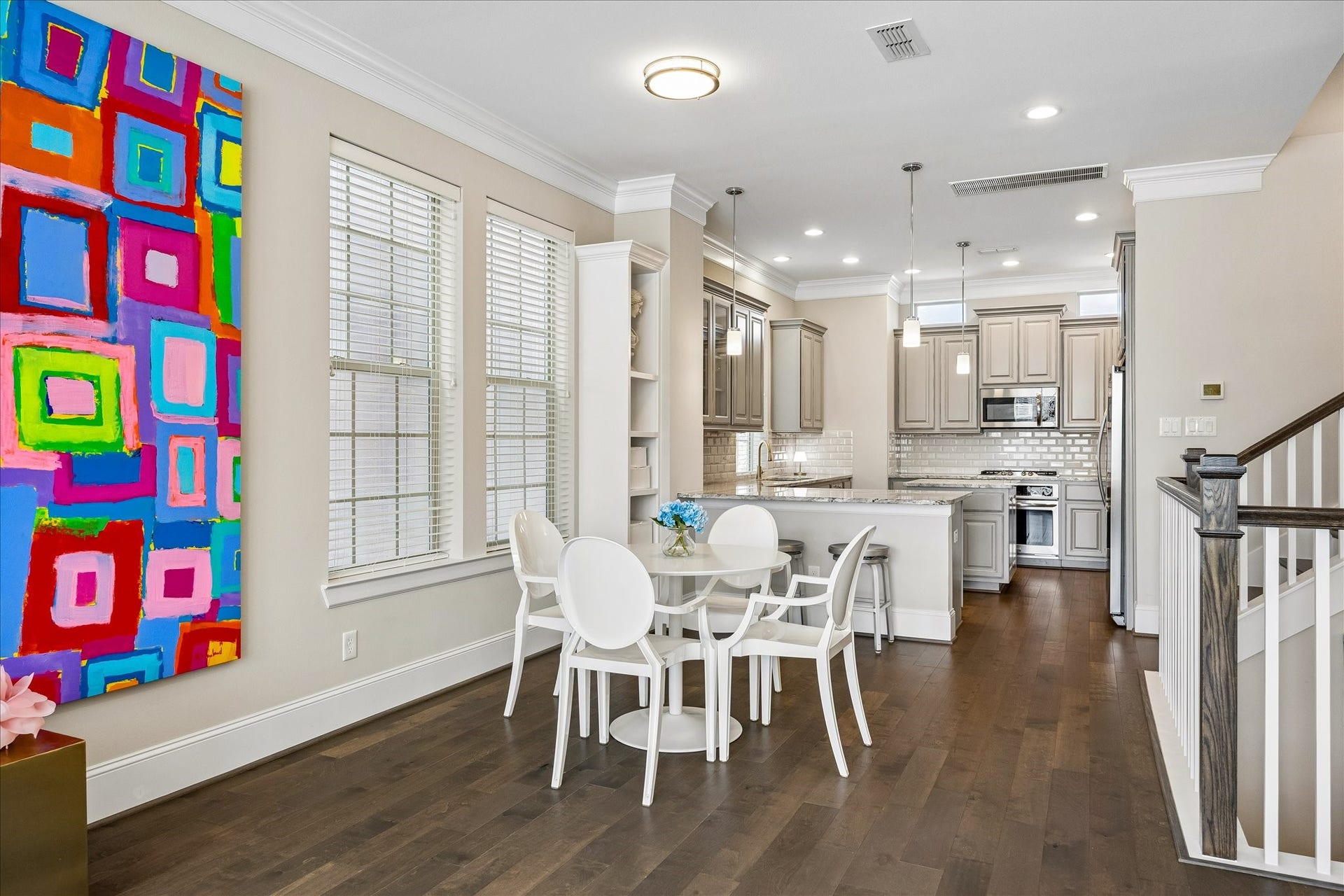 Beautiful light-filled dining area thoughtfully positioned between kitchen & living room on the 2nd floor! Large windows provide wonderful natural light while decorative flush-mount lighting enhances the space. Seamless open-concept layout allows for easy flow between dining & exquisite kitchen; ideal for everyday meals & entertaining!
