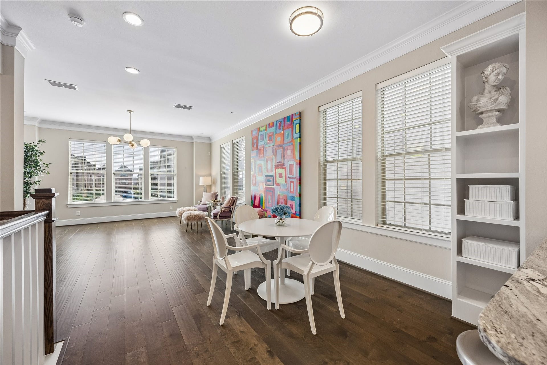 Another perspective of the inviting dining area showcasing its seamless connection to the expansive living room! Wonderful open floor plan allows each space to feel connected while maintaining its own distinct purpose. Generous proportions provide ample room for dining furnishings, creating a fabulous setting for both intimate dinners & larger gatherings!