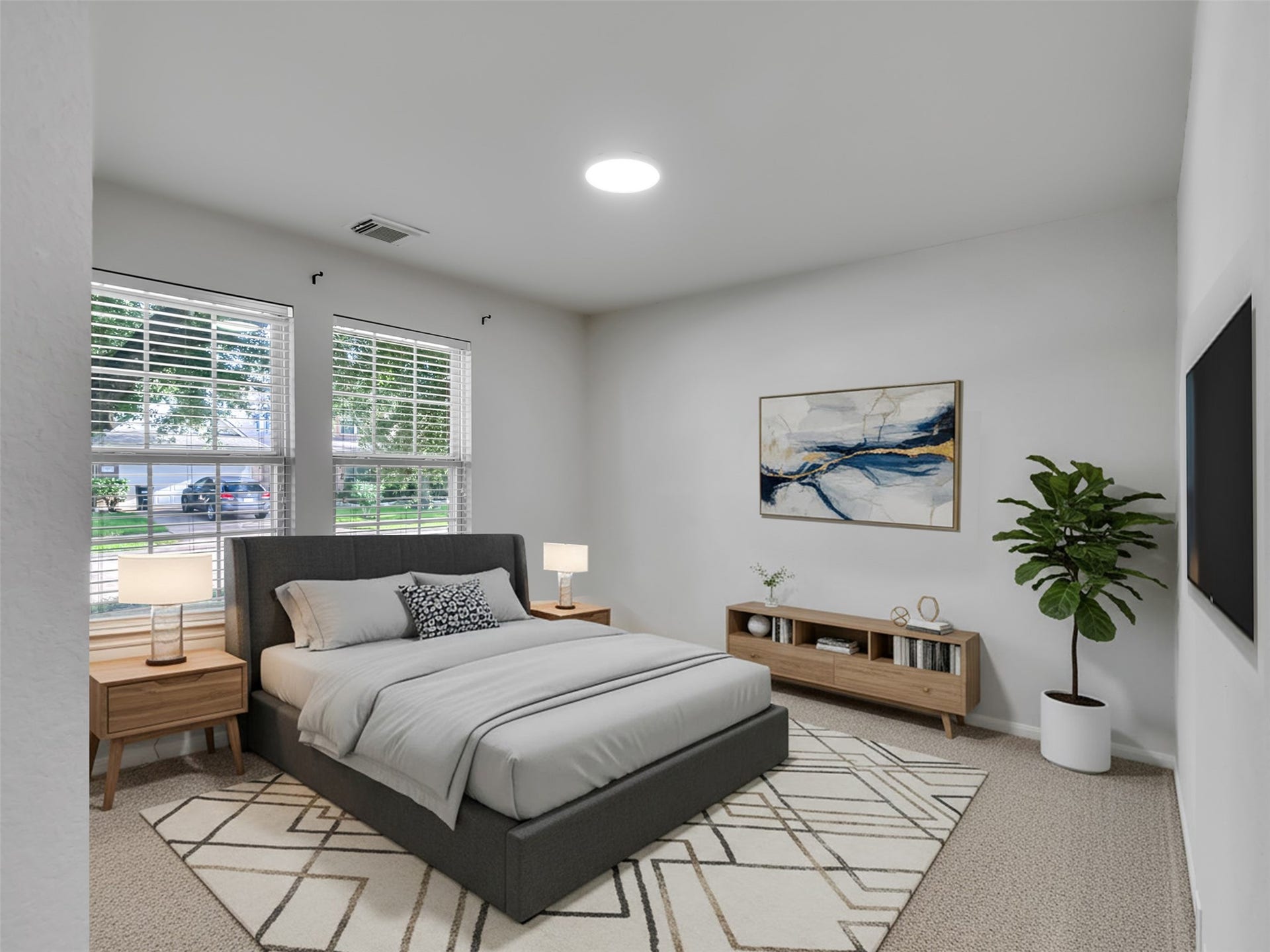 21518 Gannet Peak Way, Katy, TX 77449 This bedroom is bright and inviting, featuring large windows, a modern bed, stylish nightstands, and a cozy rug. The minimalist decor includes a wall-mounted TV, a contemporary art piece, and a potted plant, offering a serene and comfortable space.