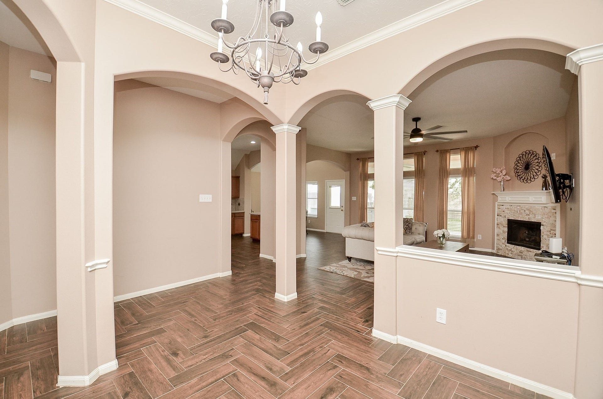 3706 Cane Lake Drive, Richmond, TX 77406 View of the hallway from the formal dining room. Notice the gleaming wood tiles throughout the common areas.