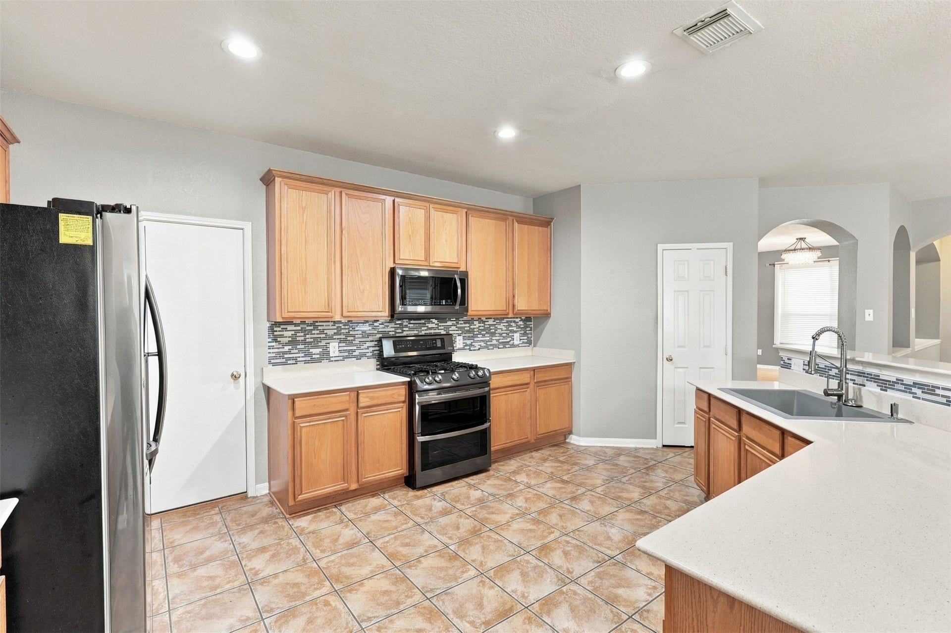 Open kitchen to living room so much space for multiple people to be in the kitchen at the same time!