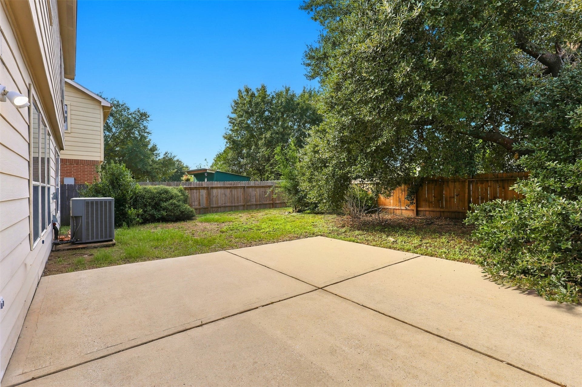 Backyard with extended concrete