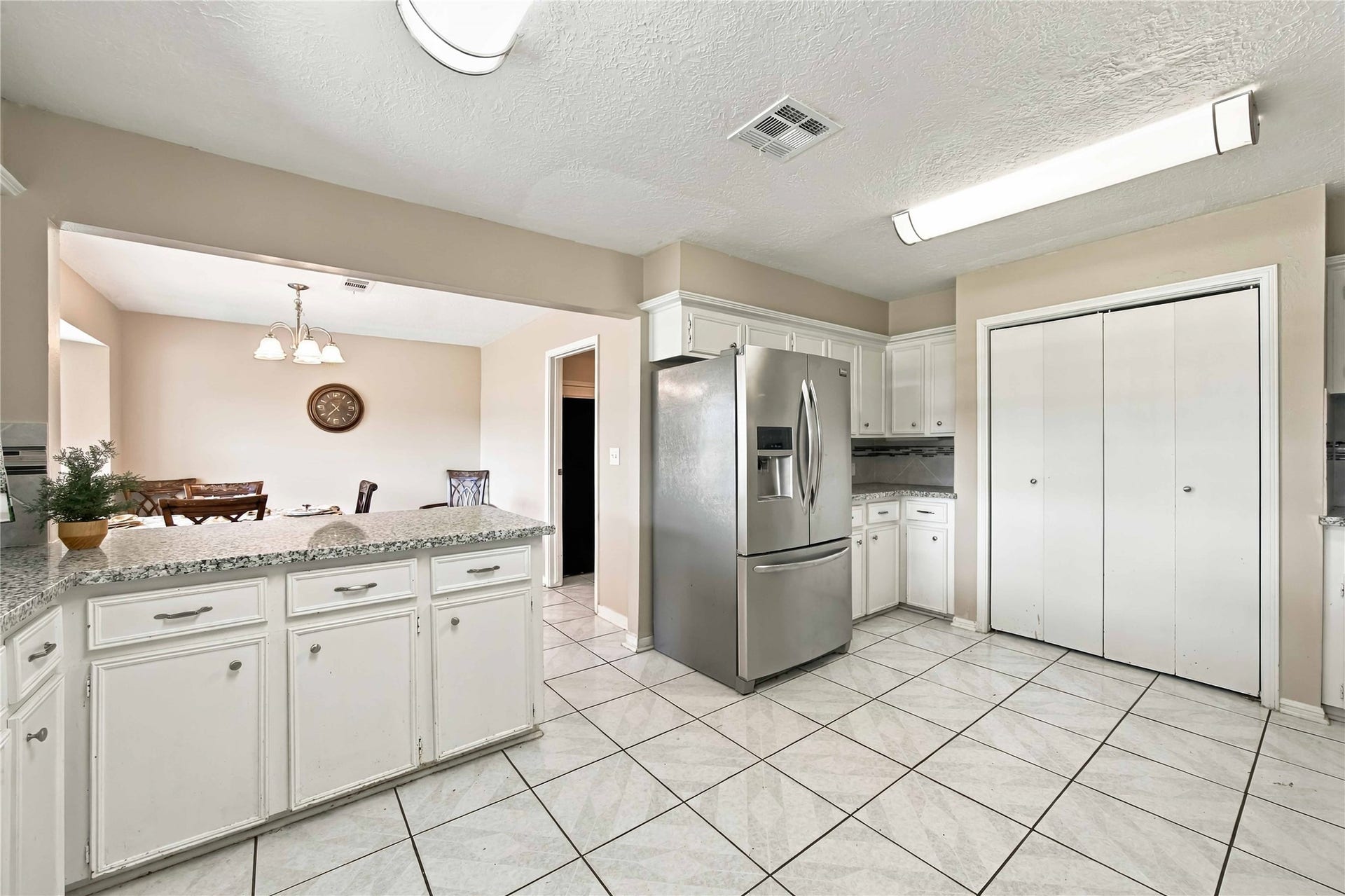 4697 Wickwillow Lane, Alvin, TX 77511 Open concept from the Kitchen toward the Dining room.