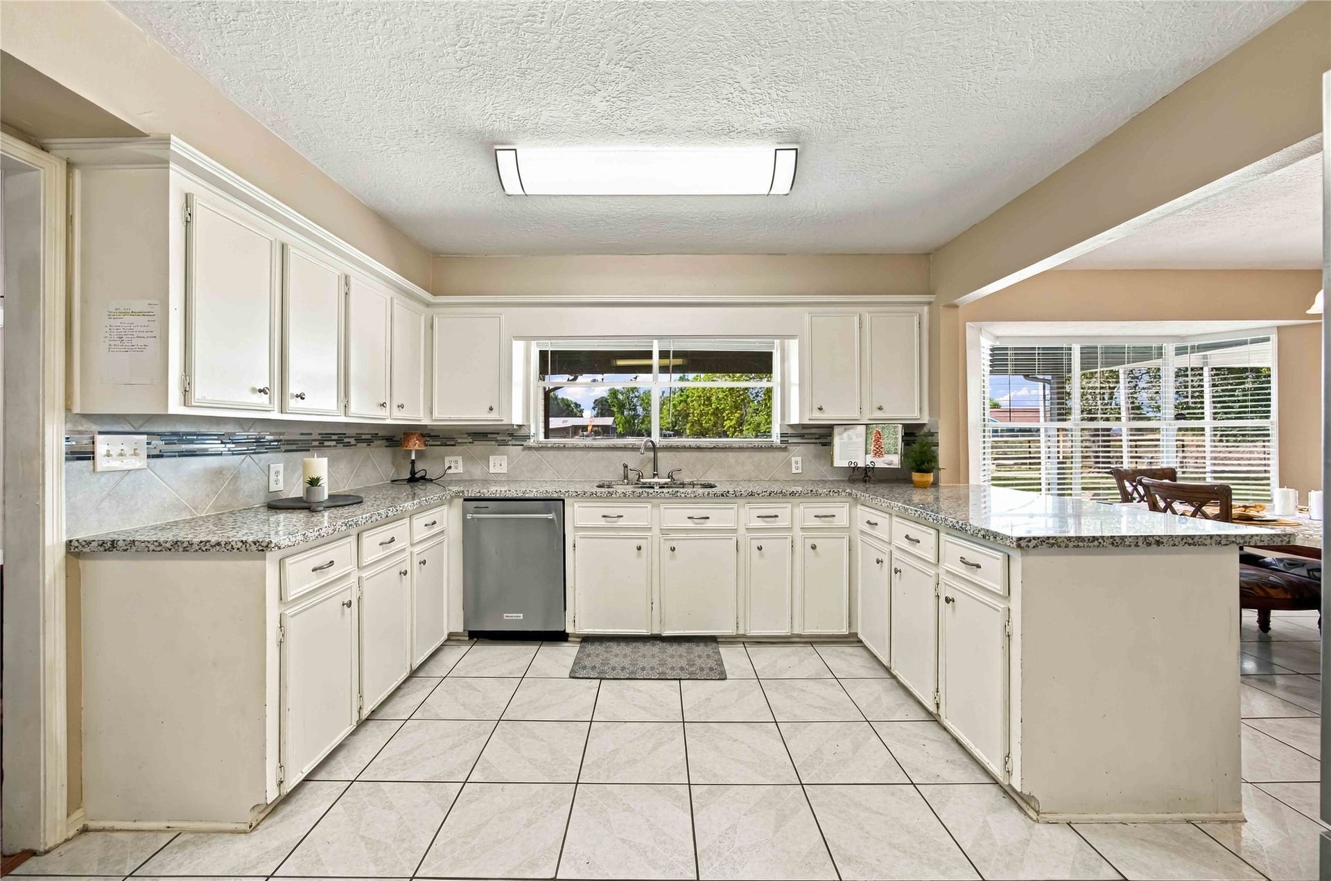 4697 Wickwillow Lane, Alvin, TX 77511 Another great view of the property from the Kitchen window. Granite countertop and lots of counters and cabinets.