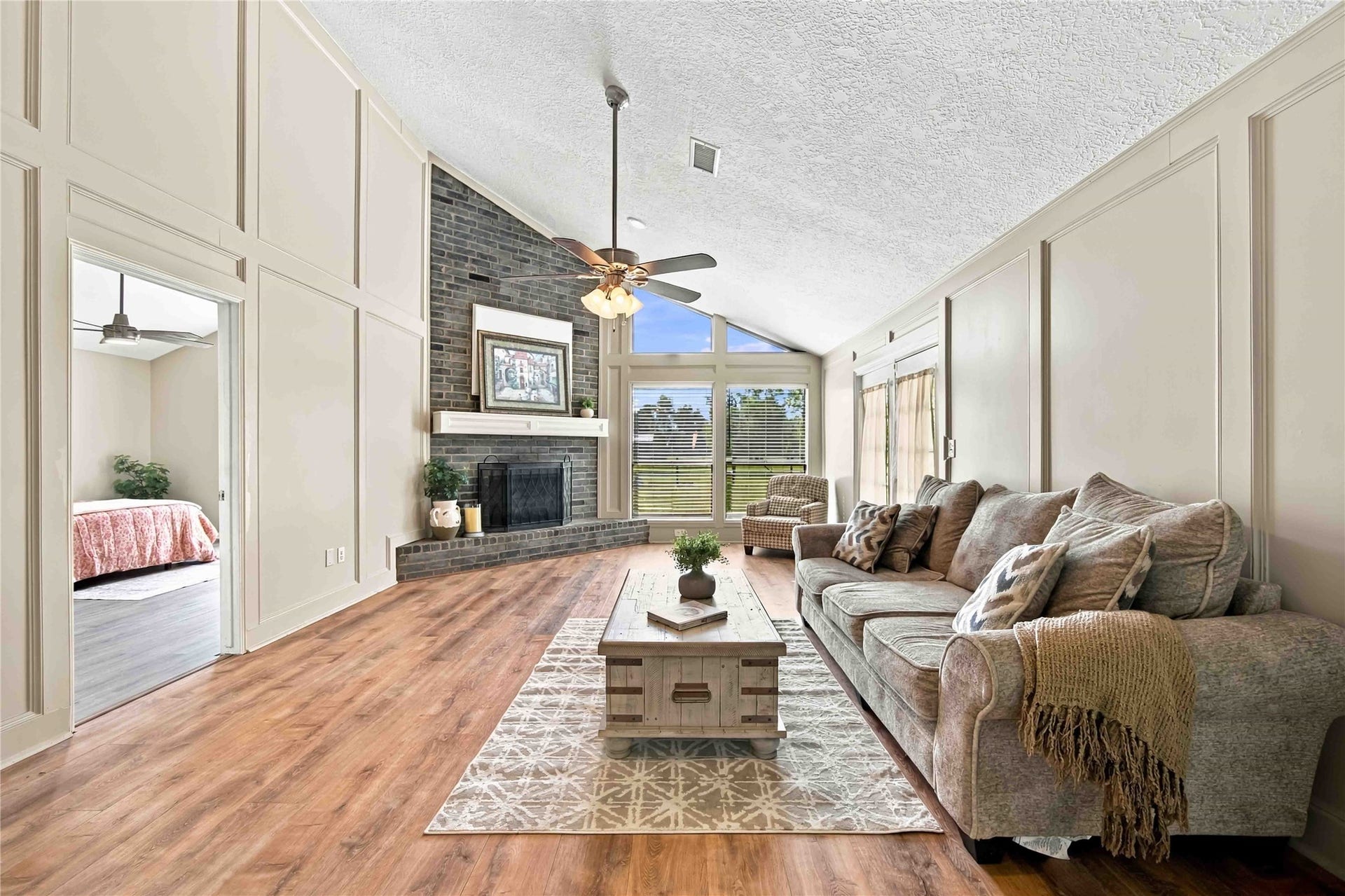 4697 Wickwillow Lane, Alvin, TX 77511 Fireplace, designer walls and beautiful floor.