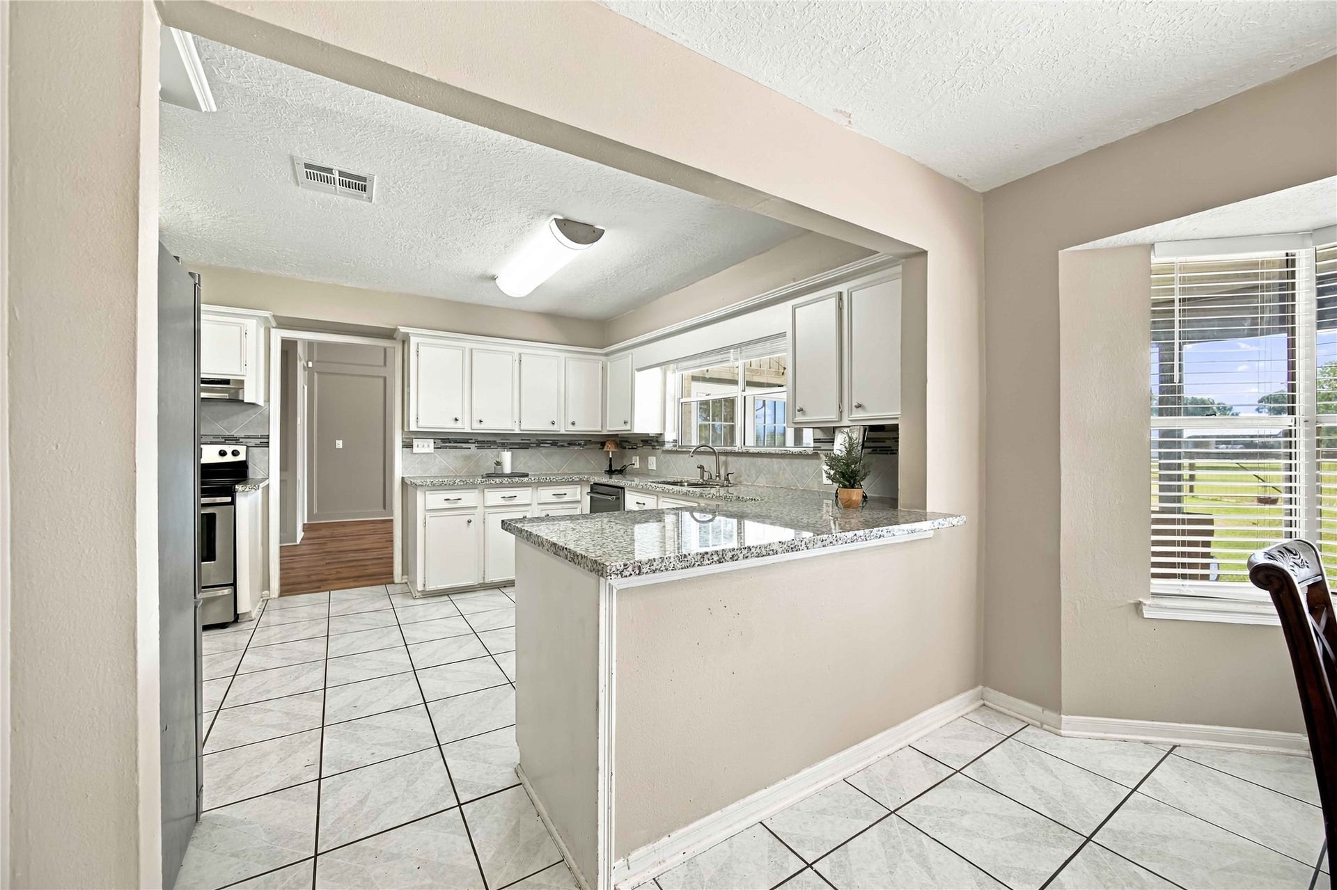 4697 Wickwillow Lane, Alvin, TX 77511 Angle from the Dining room looking into the Kitchen.