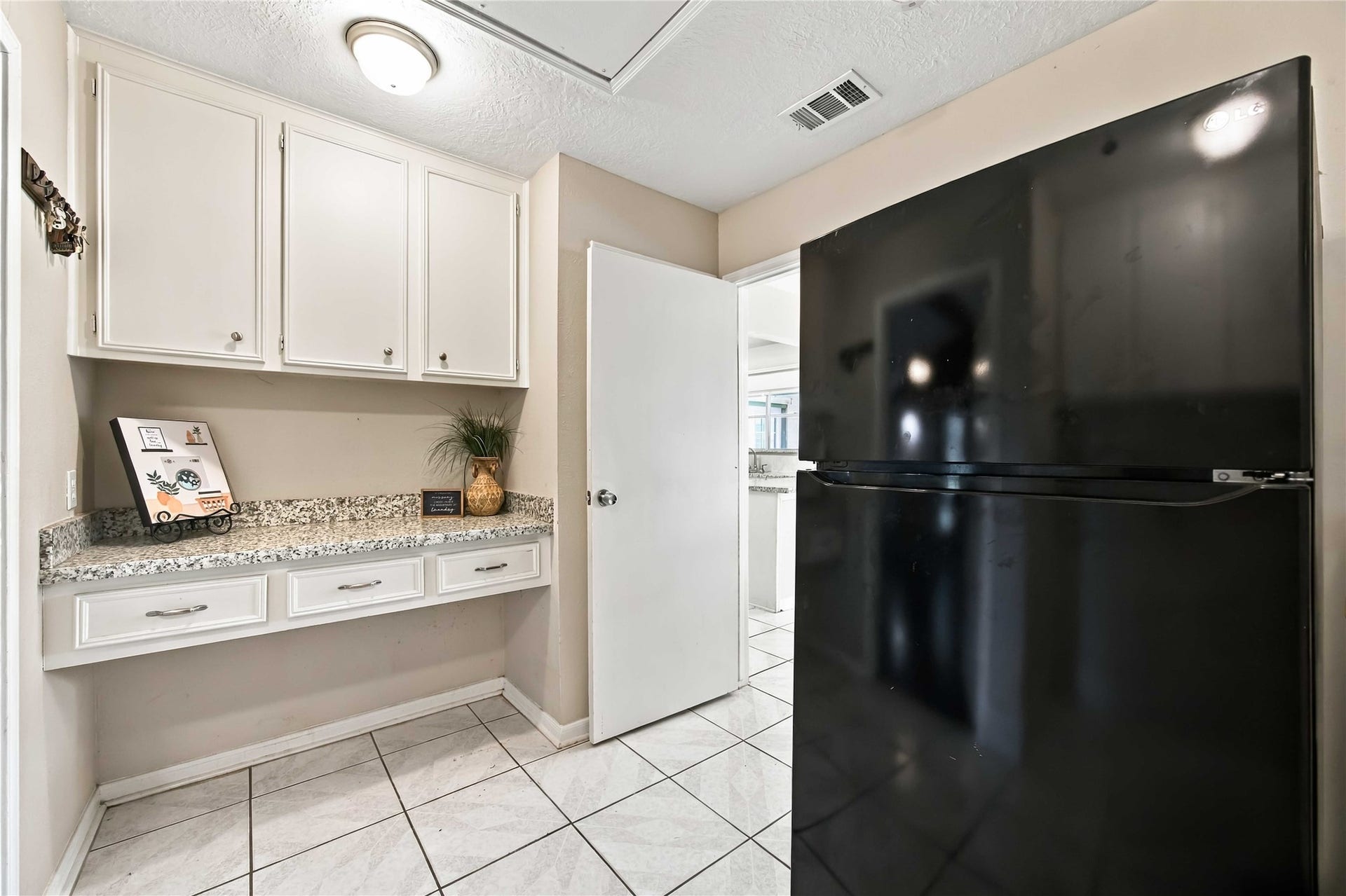 4697 Wickwillow Lane, Alvin, TX 77511 Laundry room on the other side. Large enough for that extra refrigerator.