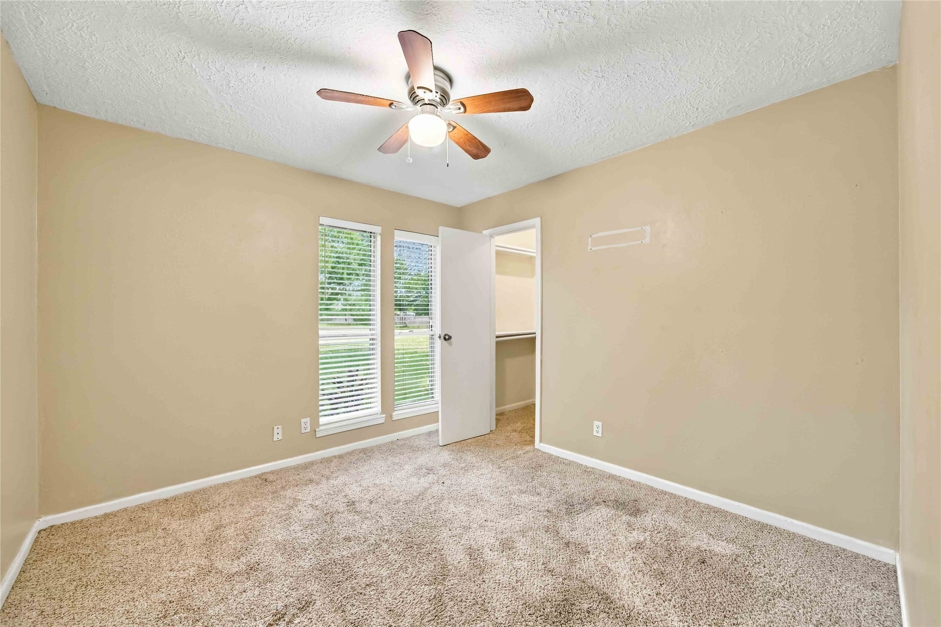 4697 Wickwillow Lane, Alvin, TX 77511 One of the 3 secondary bedroom. Walk-in closet.