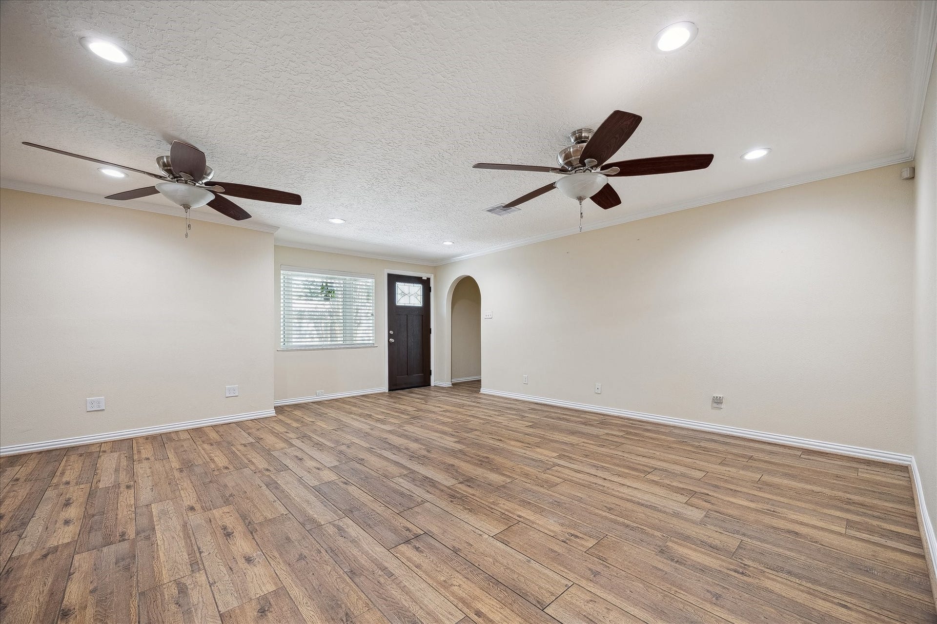 1325 Curtin Street, Houston, TX 77018 Open concept living / dining with wood look tile floors throughout