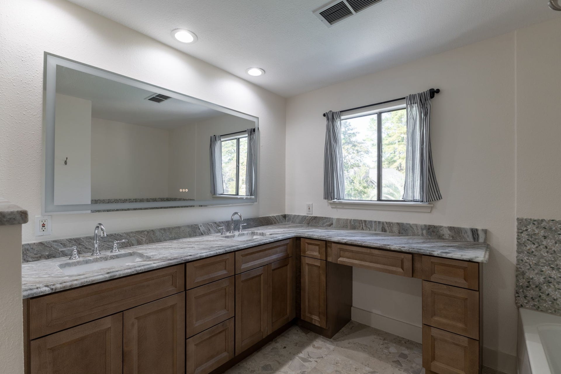 6506 Jadecrest Drive, Spring, TX 77389 68in LED fog proof mirror. Vanity out looking the tree tops