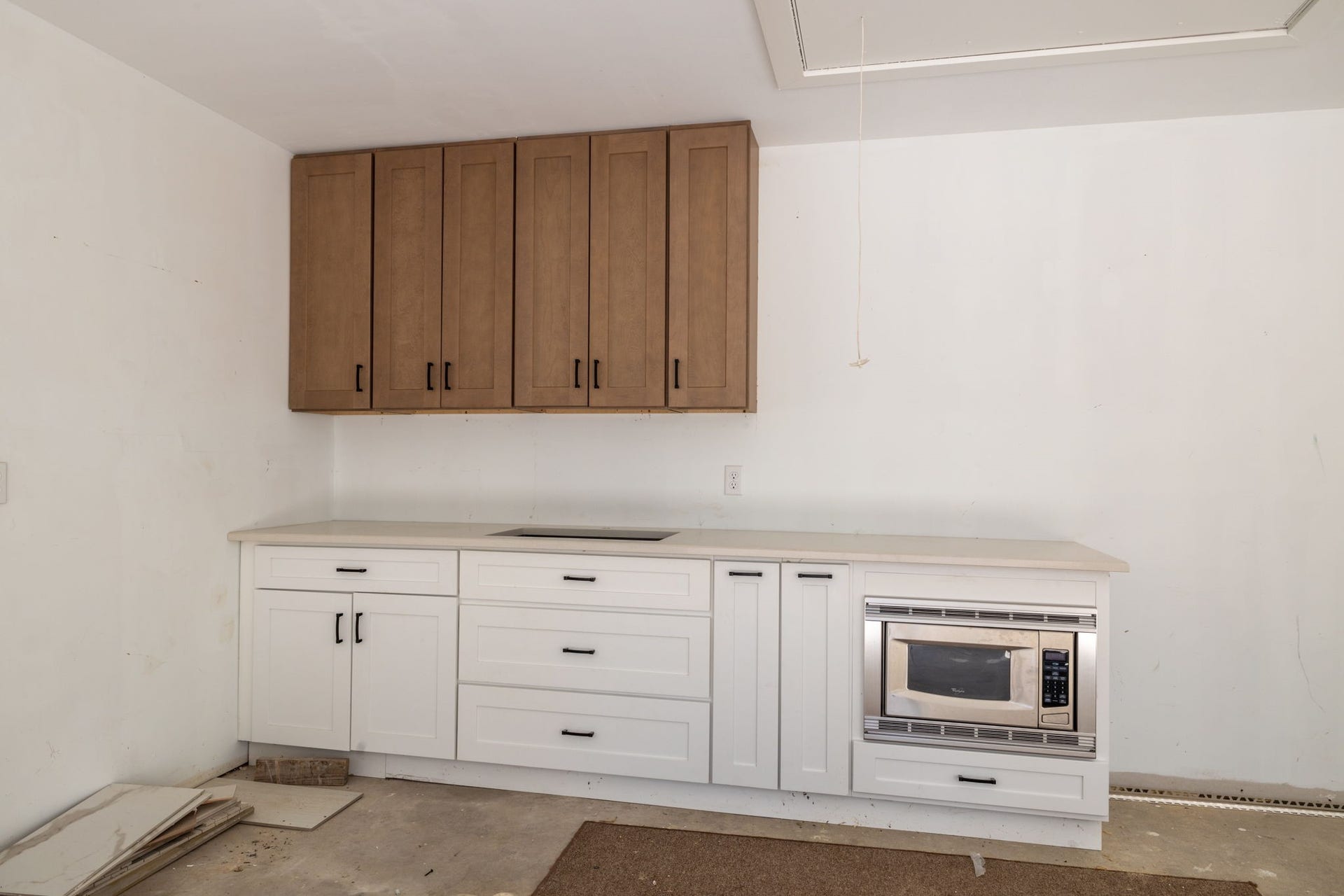 6506 Jadecrest Drive, Spring, TX 77389 Cabinets in the garage with a place for a fridge.