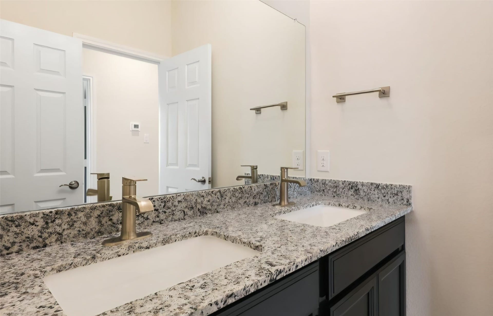 3104 Dakota Falls Drive, Houston, TX 77063 Primary bedroom has nice dual vanity sinks