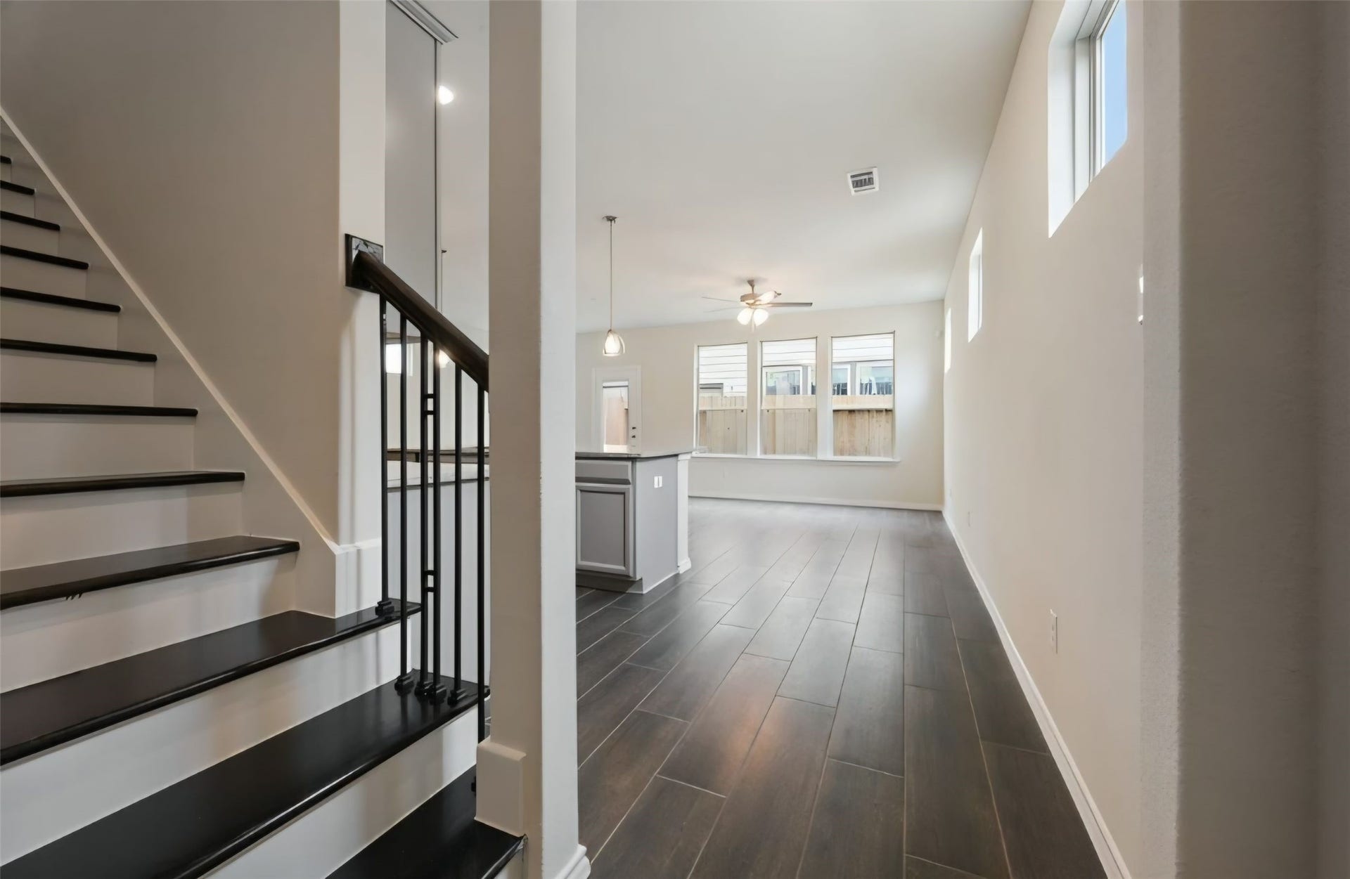 3104 Dakota Falls Drive, Houston, TX 77063 Nice entry, greets with elevated ceilings, elegant staircase with solid wood treads, white painted risers and a minimalist accent of modern wrought-iron balusters providing character to this home