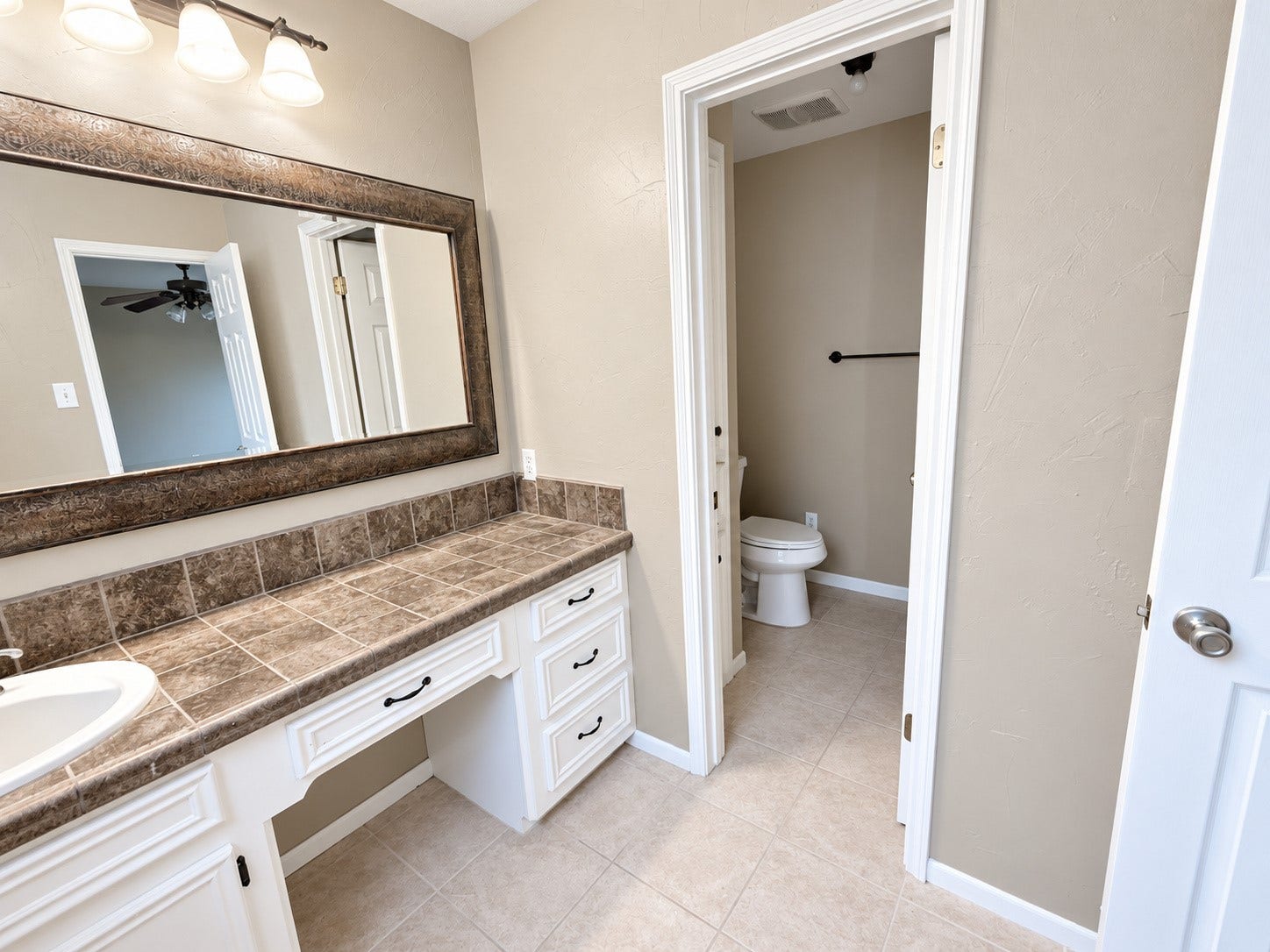 2026 Arcadia Drive, Sugar Land, TX 77498 Bathroom / Vanity & Toilet Area: Functional bathroom layout with a spacious vanity, ample storage, and a separate toilet area for added privacy.