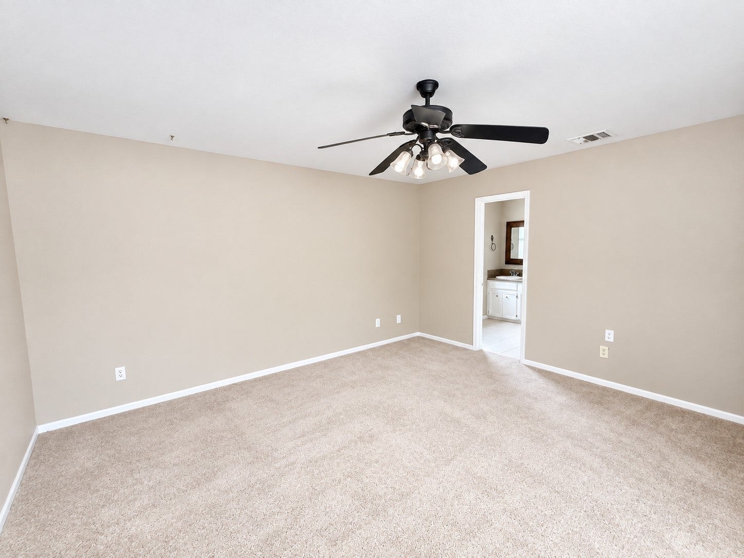 2026 Arcadia Drive, Sugar Land, TX 77498 Primary Bedroom / Ensuite Access: Spacious bedroom with direct access to the adjoining bathroom, offering convenience and privacy.