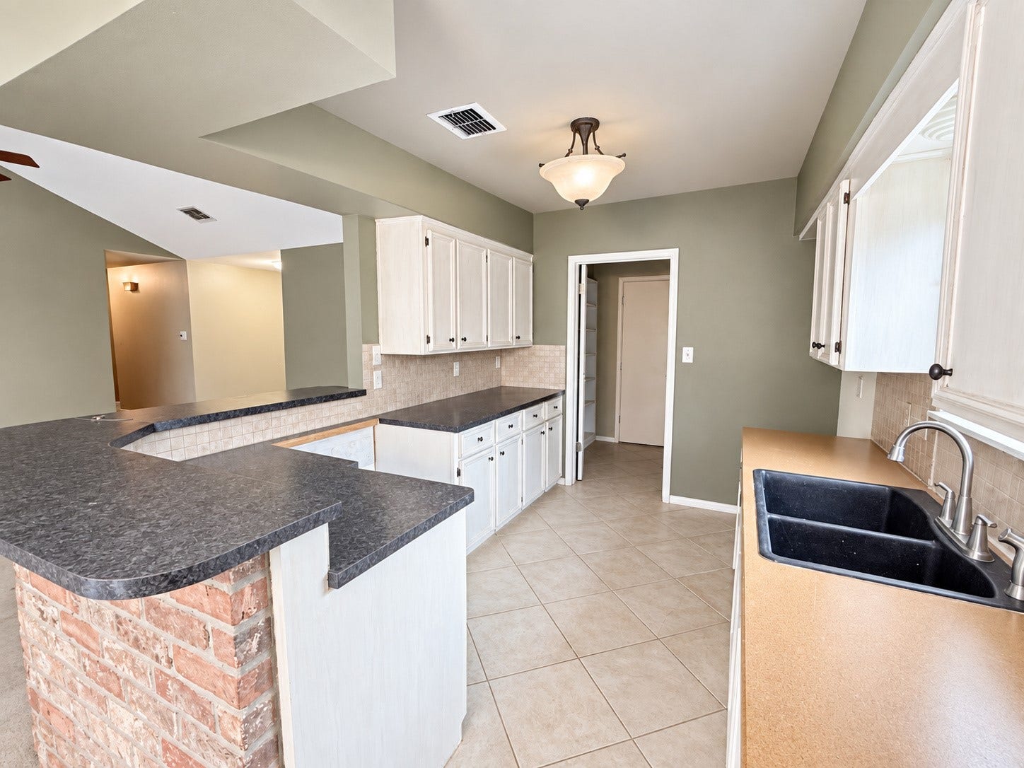 2026 Arcadia Drive, Sugar Land, TX 77498 Kitchen: Spacious kitchen with generous counter space, ample cabinetry, and an open layout that keeps you connected to the surrounding living areas.
