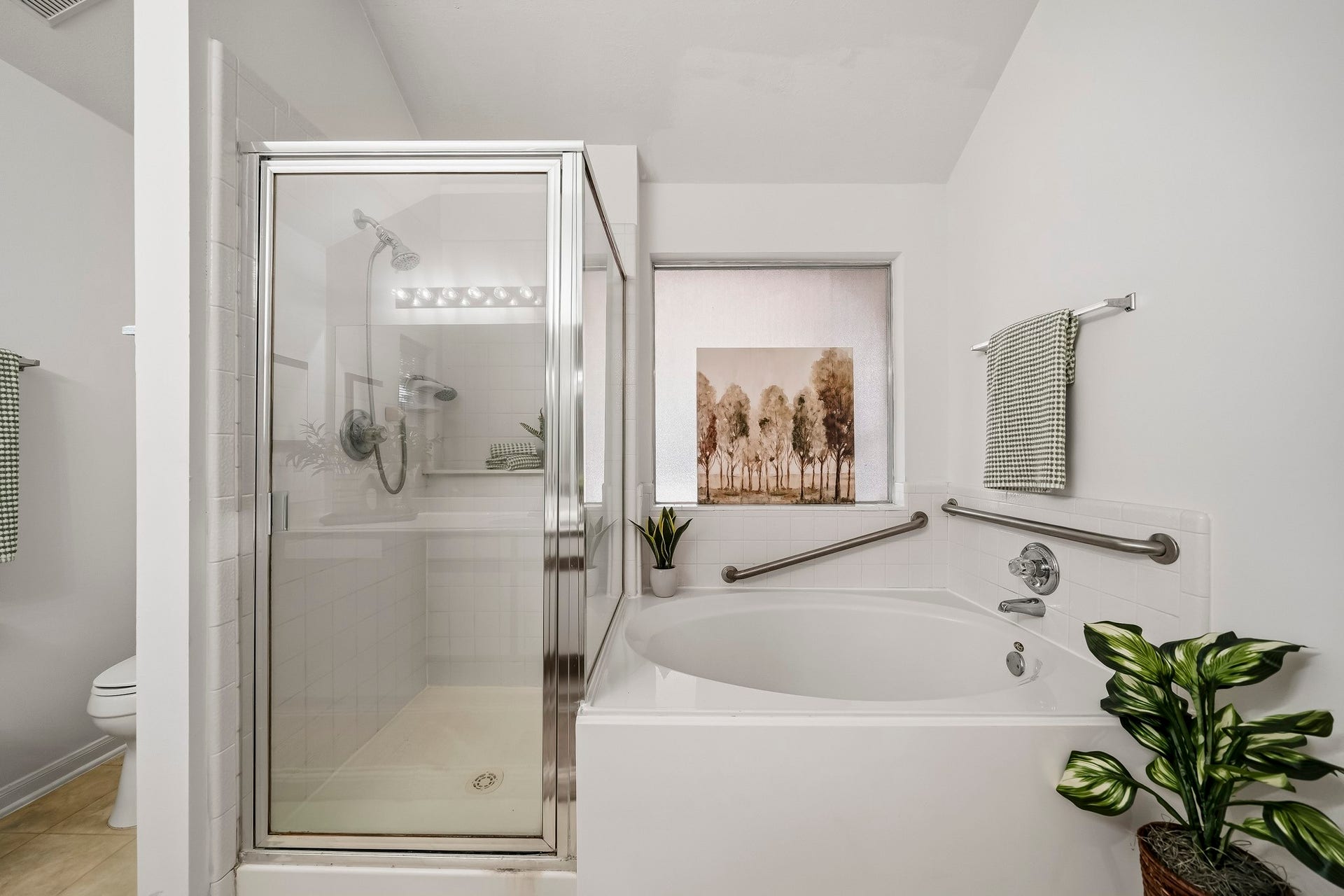 16831 Dunbar Grove Ct, Sugar Land, TX 77498 A separate tiled shower features a convenient ledge for bath products, while the soaking tub offers a relaxing place to unwind at the end of the day.