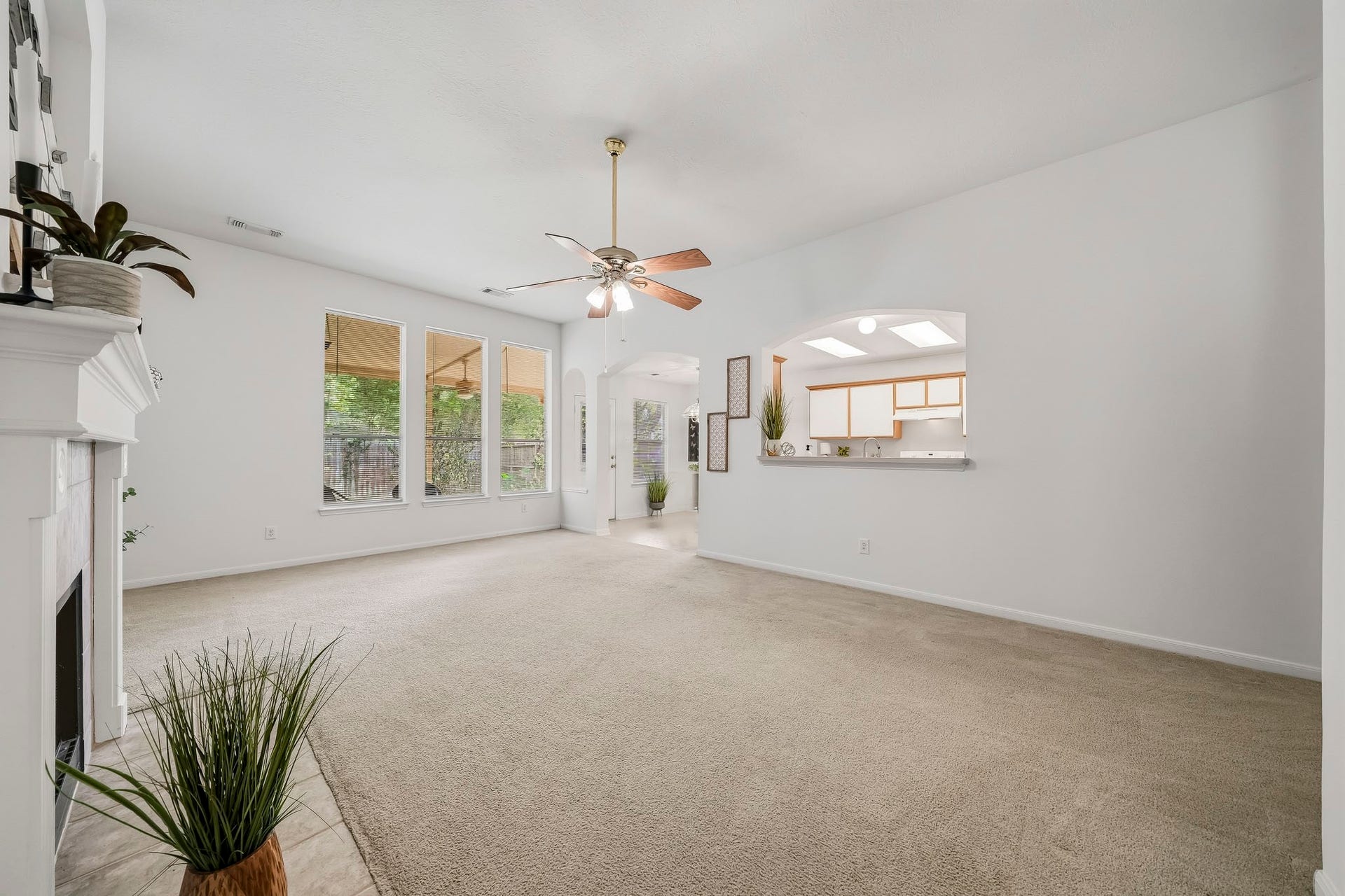 16831 Dunbar Grove Ct, Sugar Land, TX 77498 This view highlights the easy connection between the family room, breakfast area and kitchen, along with the natural light provided by the large backyard-facing windows.