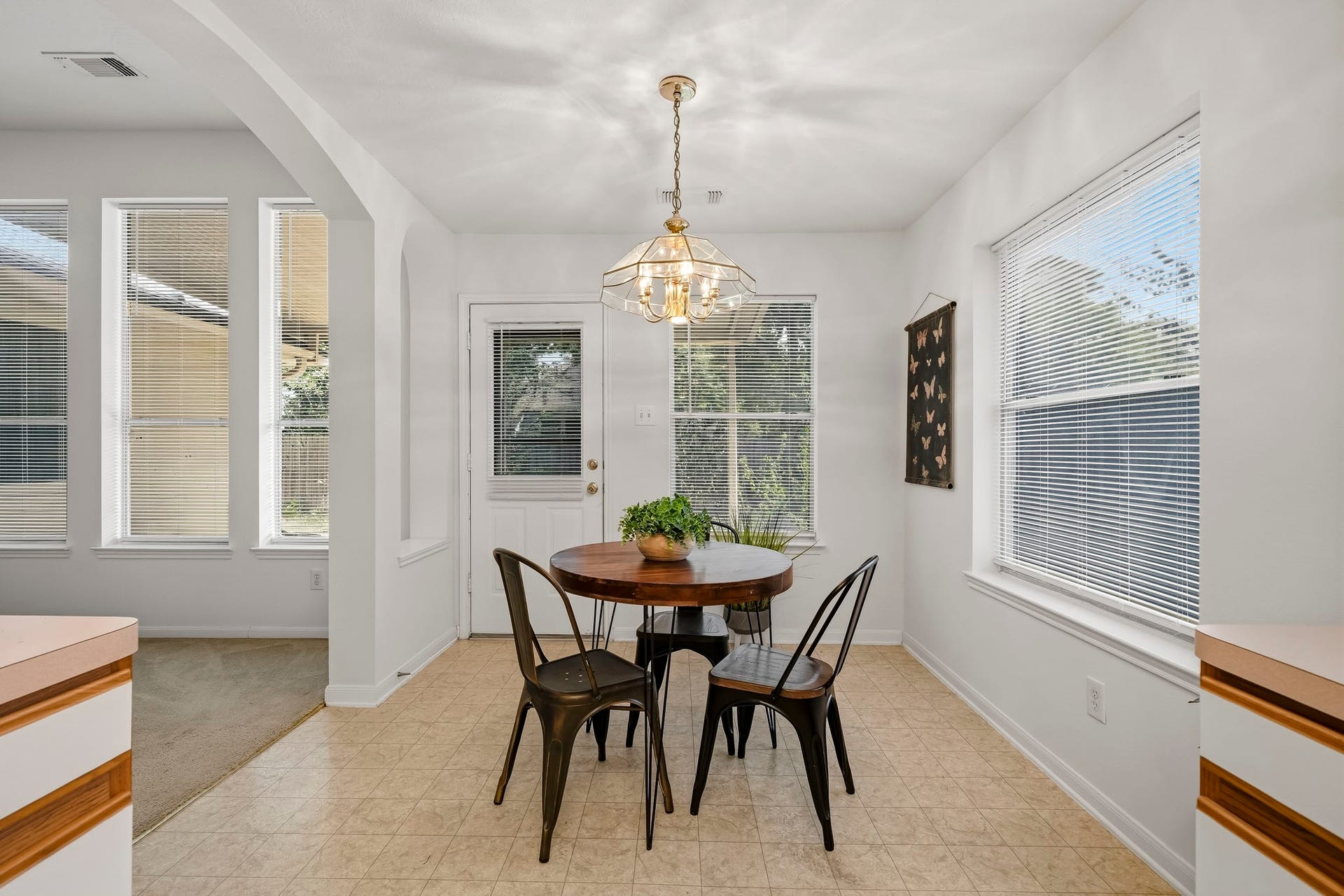 16831 Dunbar Grove Ct, Sugar Land, TX 77498 Morning light fills the east-facing breakfast room, while the nearby back door provides easy access to the covered patio and private backyard.