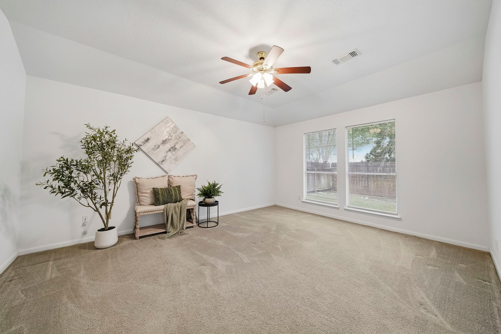 16831 Dunbar Grove Ct, Sugar Land, TX 77498 Tucked toward the back of the home, the primary suite feels private and welcoming, with windows overlooking the backyard.