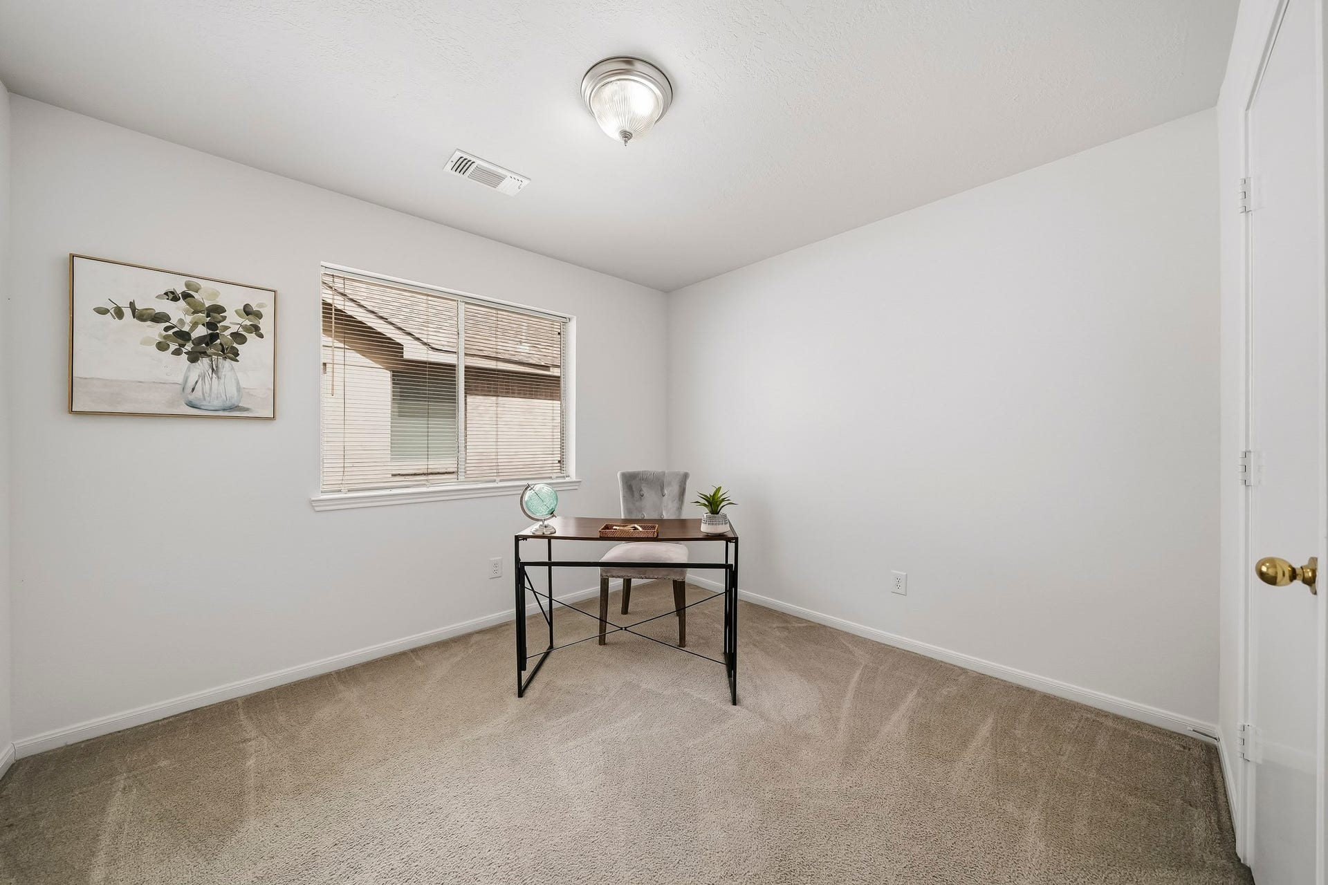 16831 Dunbar Grove Ct, Sugar Land, TX 77498 Located on the opposite side of the home from the primary suite, Bedroom #2 is currently staged as a home office, showcasing its versatility.