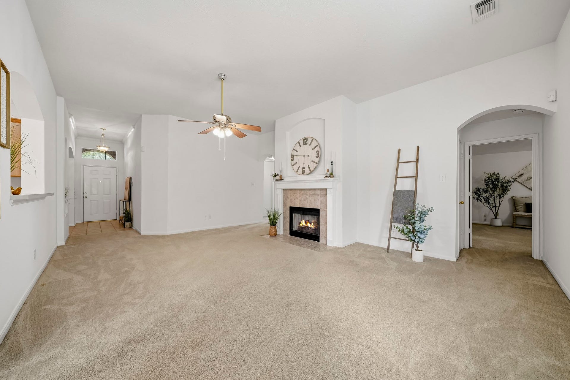 16831 Dunbar Grove Ct, Sugar Land, TX 77498 The generous family room easily accommodates a large sectional and coffee table, with additional space near the windows for a cozy sitting or reading area.