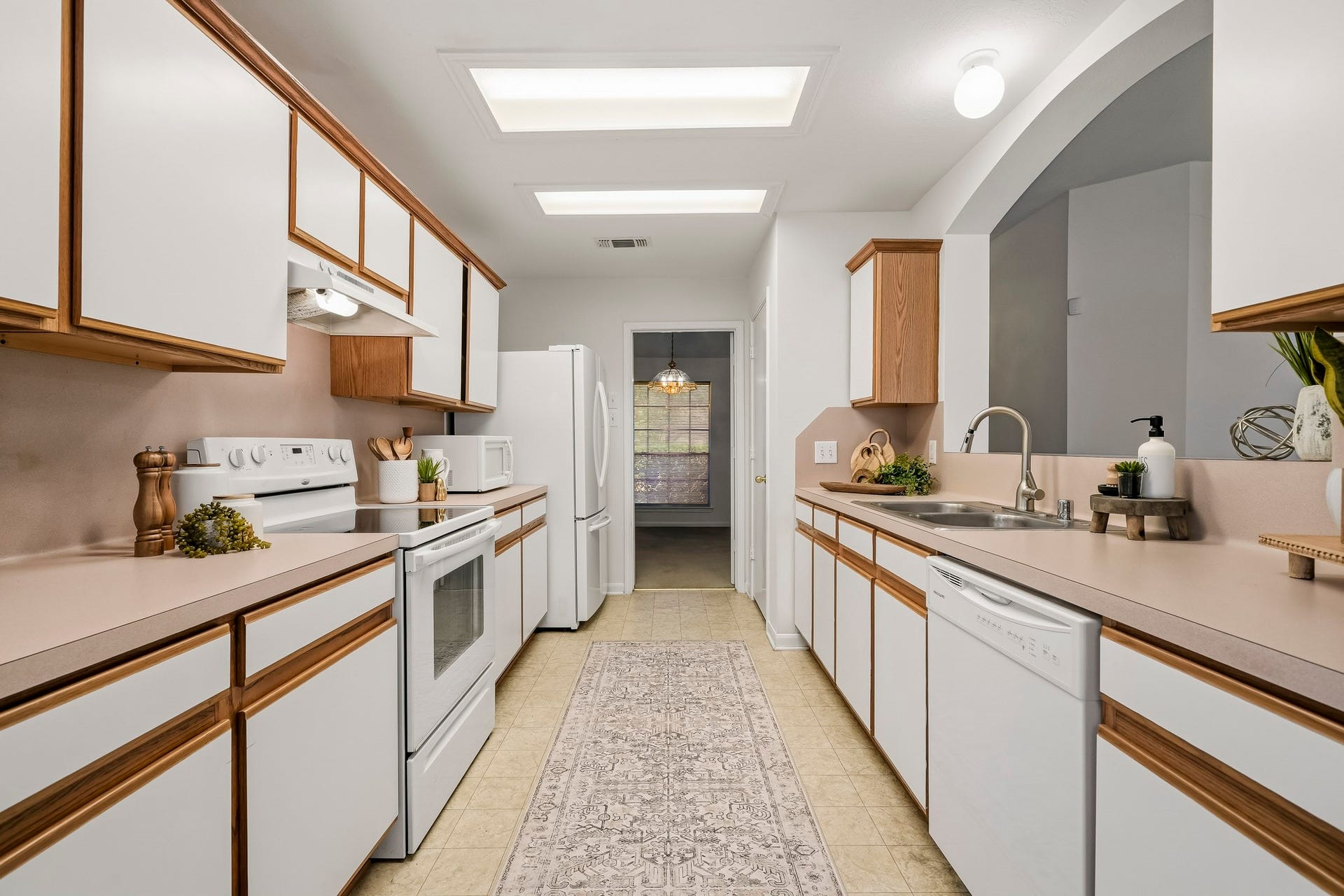 16831 Dunbar Grove Ct, Sugar Land, TX 77498 The kitchen offers generous counter space for meal prep along with plenty of cabinetry and drawers for everyday storage.