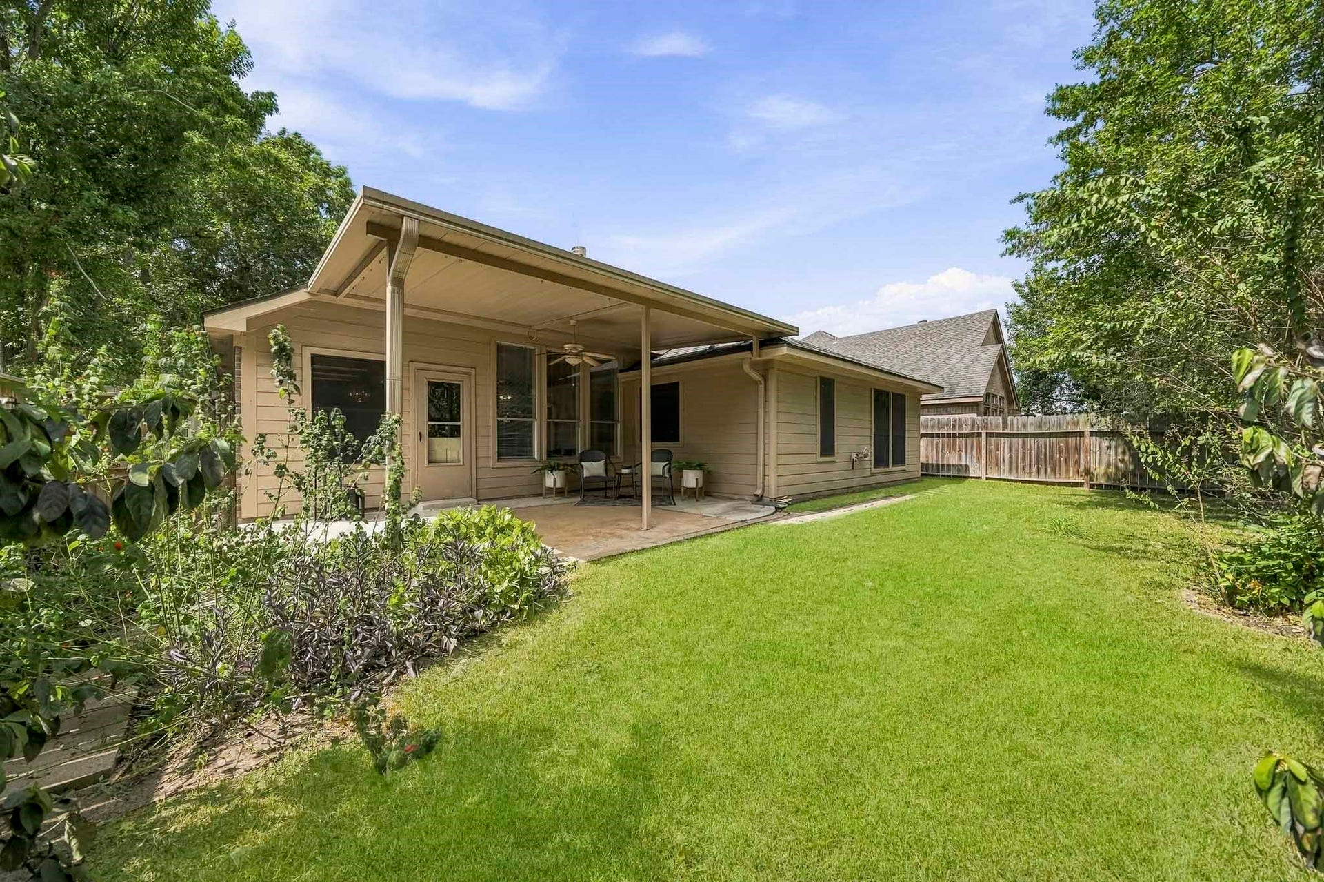 16831 Dunbar Grove Ct, Sugar Land, TX 77498 The east-facing backyard enjoys morning sunshine while avoiding the strongest western afternoon suna welcome feature for evenings on the covered patio.