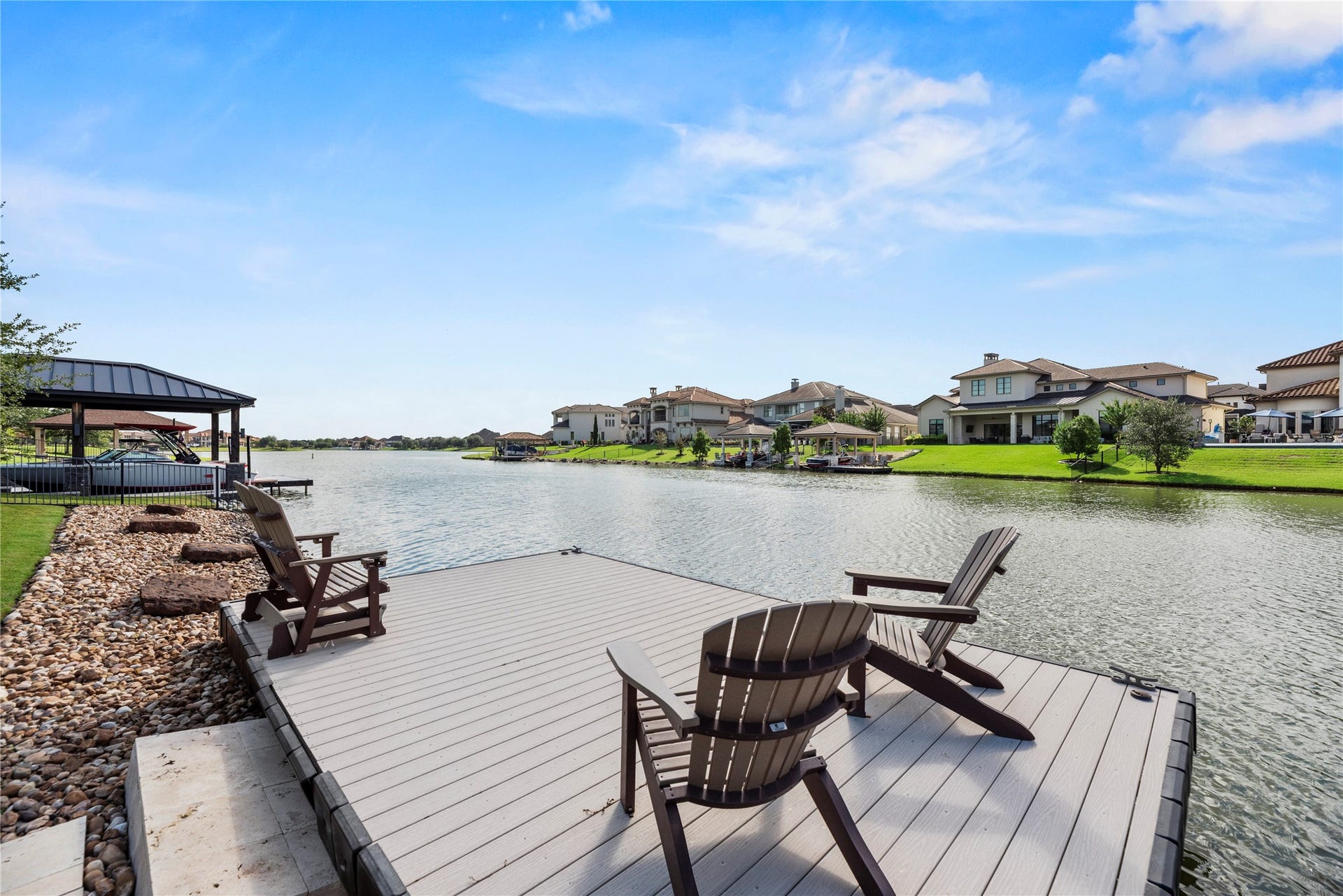10314 Joshua Creek Court, Cypress, TX 77433 Private waterfront dock offering a front-row seat to tranquil lake views and the beauty of this surrounding luxury community.