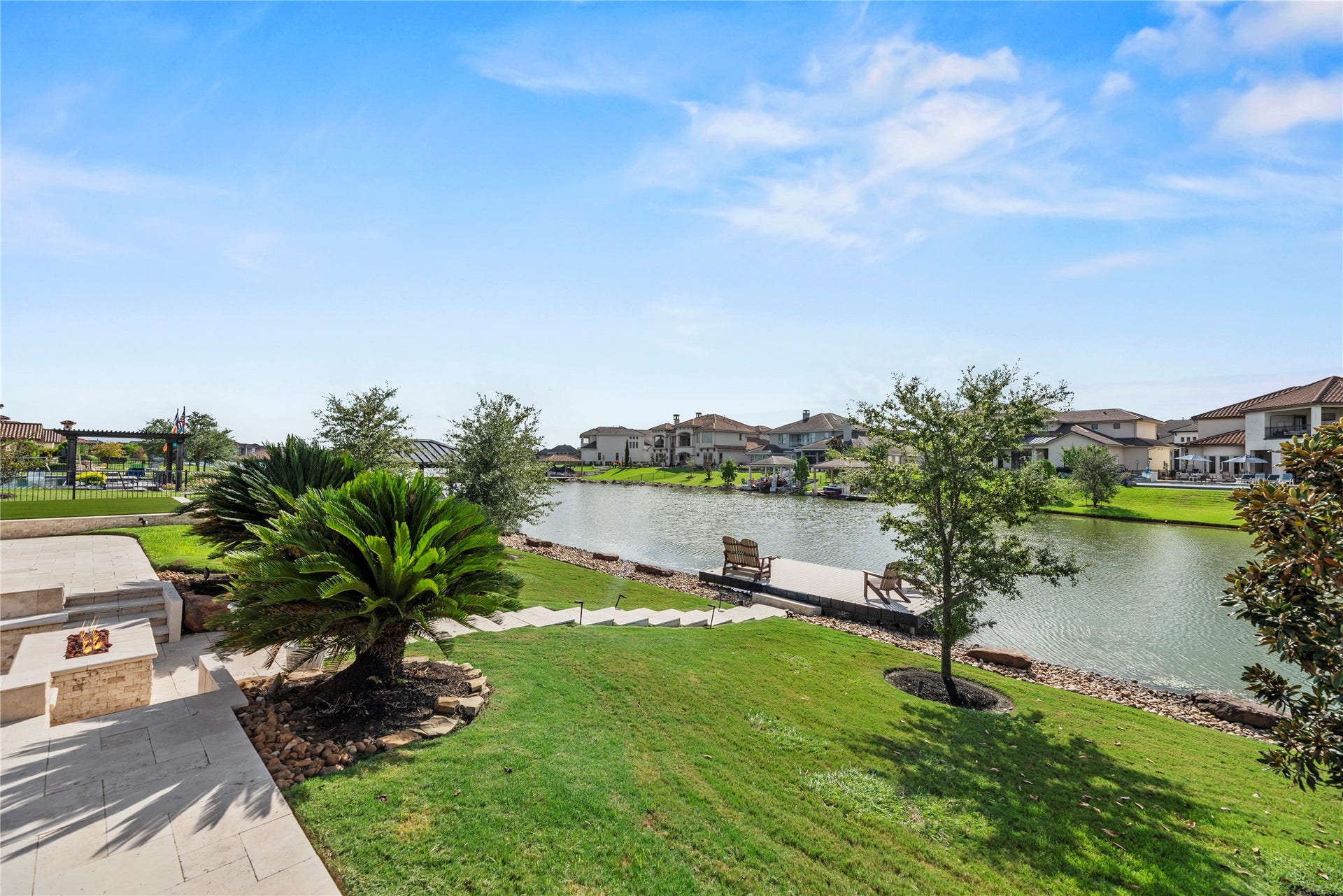 10314 Joshua Creek Court, Cypress, TX 77433 Picturesque lakefront grounds with lush landscaping, a private dock and tranquil water views that create an exceptional setting for outdoor living.