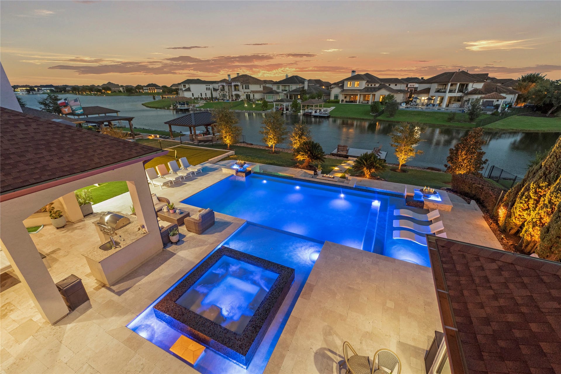 10314 Joshua Creek Court, Cypress, TX 77433 View of the backyard and lake from the upstairs balcony.