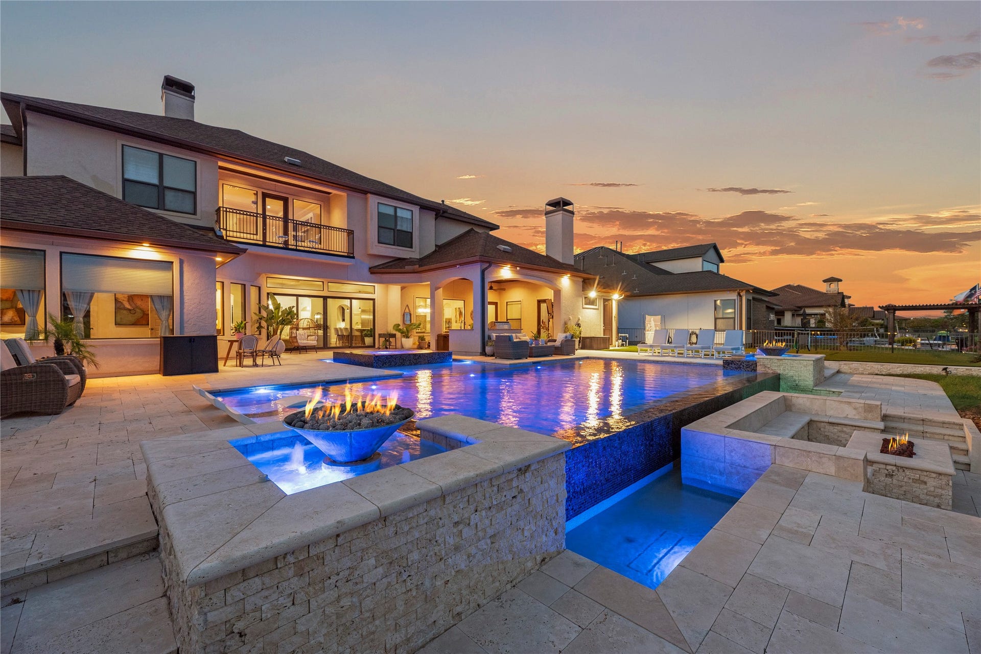 10314 Joshua Creek Court, Cypress, TX 77433 Resort-style infinity pool and spa create a spectacular outdoor retreat, highlighted by dramatic fire features and expansive patio space.