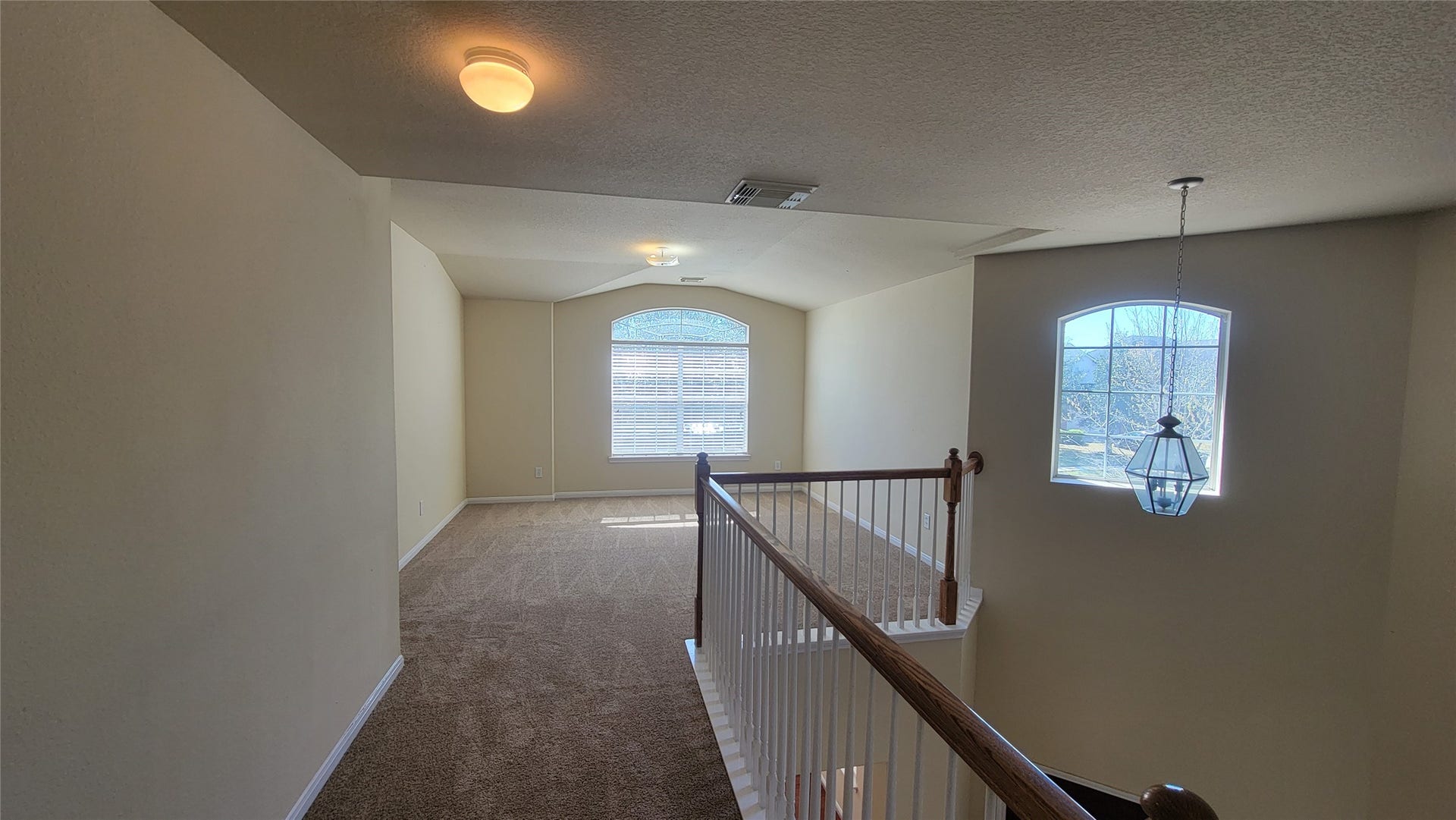 2502 Quiet Sage Lane, Katy, TX 77494 Upstairs features a spacious game room with an elegant view over the staircase.