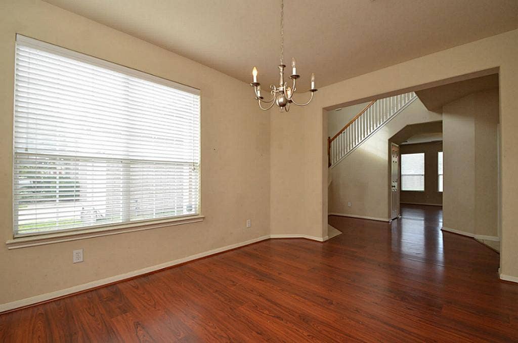 2502 Quiet Sage Lane, Katy, TX 77494 Bright dining area featuring elegant light fixtures, creating a welcoming ambiance.