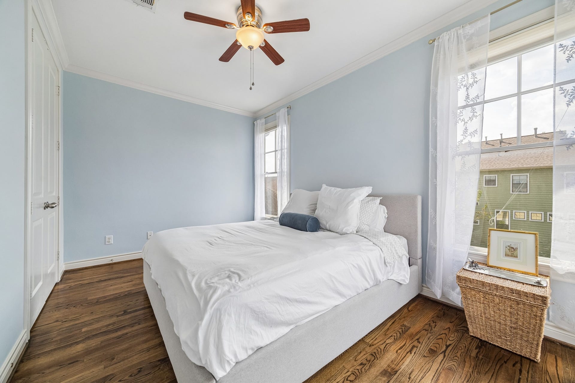 The 3rd floor secondary bedroom is at the opposite end of the hall from the primary ensuite with the laundry room and hall bath separating them. The doors to the left open into the closet.