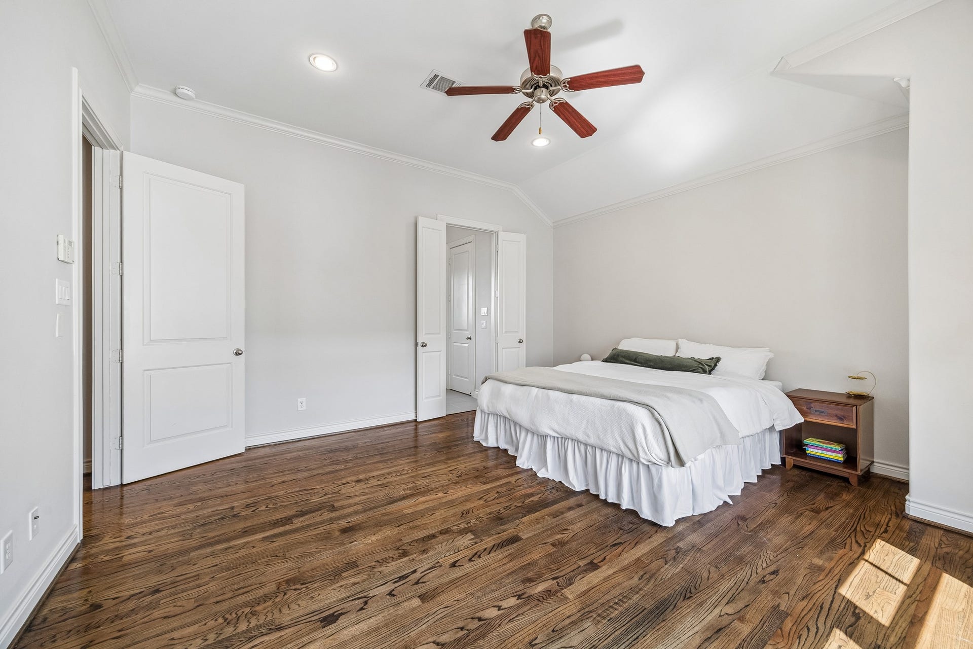 The primary ensuite feels like a private retreat with the finishes that are consistent throughout: solid oak hardwood floors, crown molding and large picture windows.