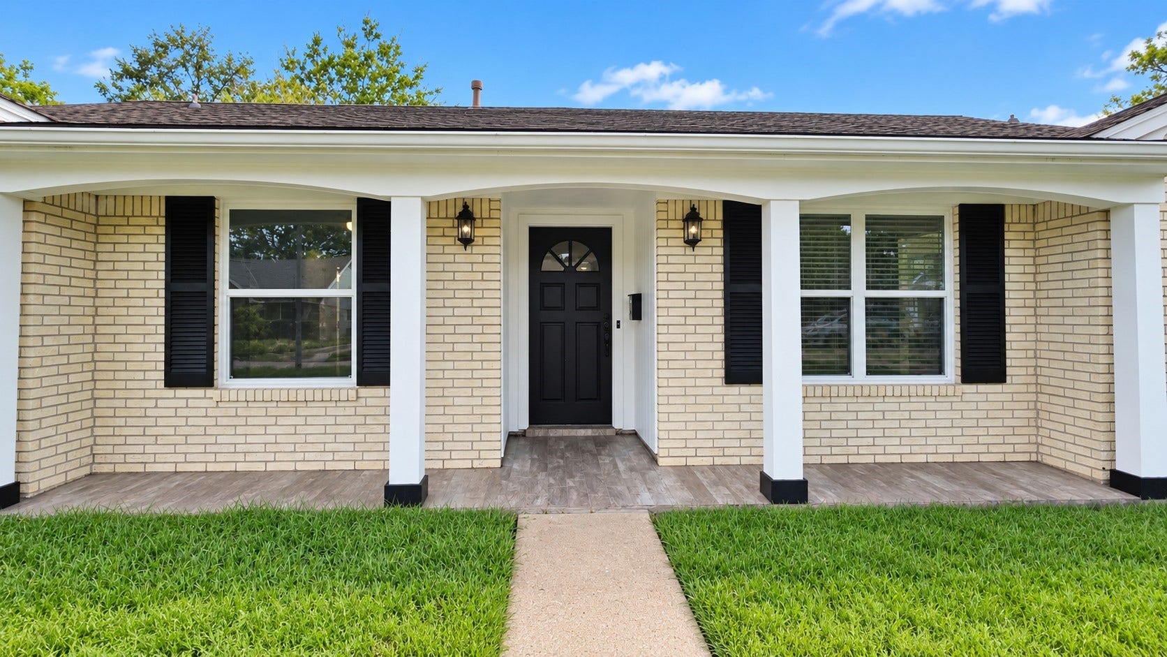 5527 Wigton Drive, Houston, TX 77096 Charming single-story brick home with a welcoming covered front porch and timeless curb appeal.