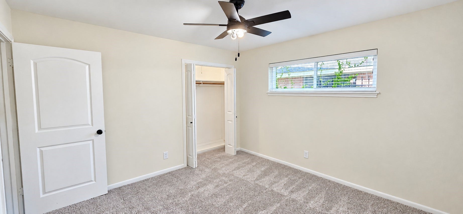 5527 Wigton Drive, Houston, TX 77096 Bright secondary bedroom offers comfortable proportions, closet space, and a ceiling fan.