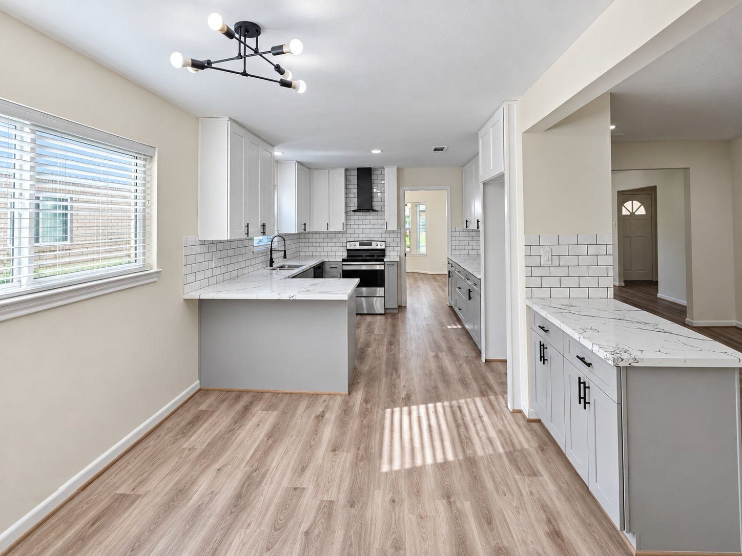 5527 Wigton Drive, Houston, TX 77096 Bright breakfast area opens directly to the kitchen for an effortless flow between dining and meal preparation.