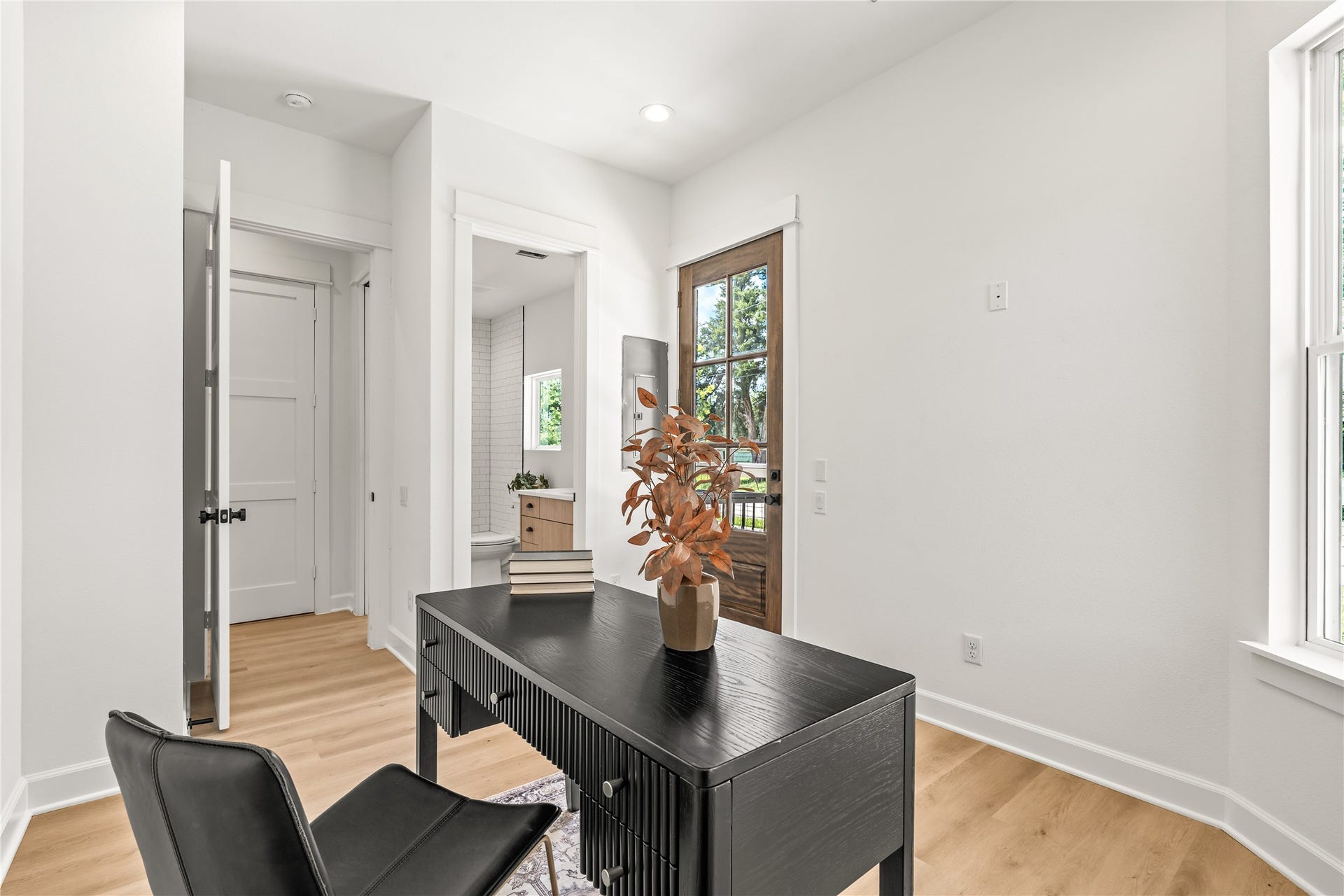 7432-7444 Tremper Street, Houston, TX 77020 Alternate elevation first-floor bedroom with glass back door and natural light throughout