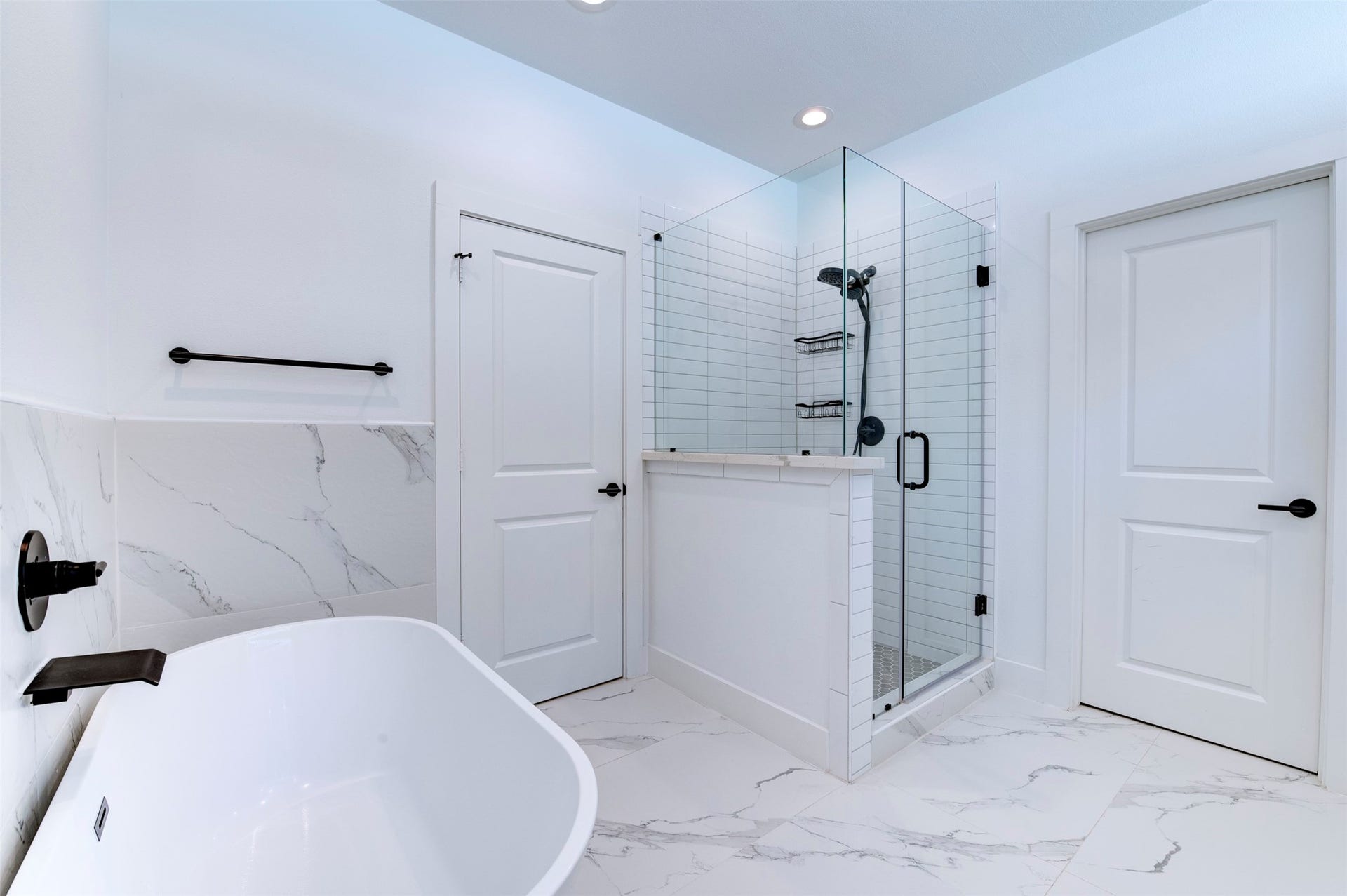 10910 Fire Creek Drive, Houston, TX 77043 Primary bathroom with shower and tub.