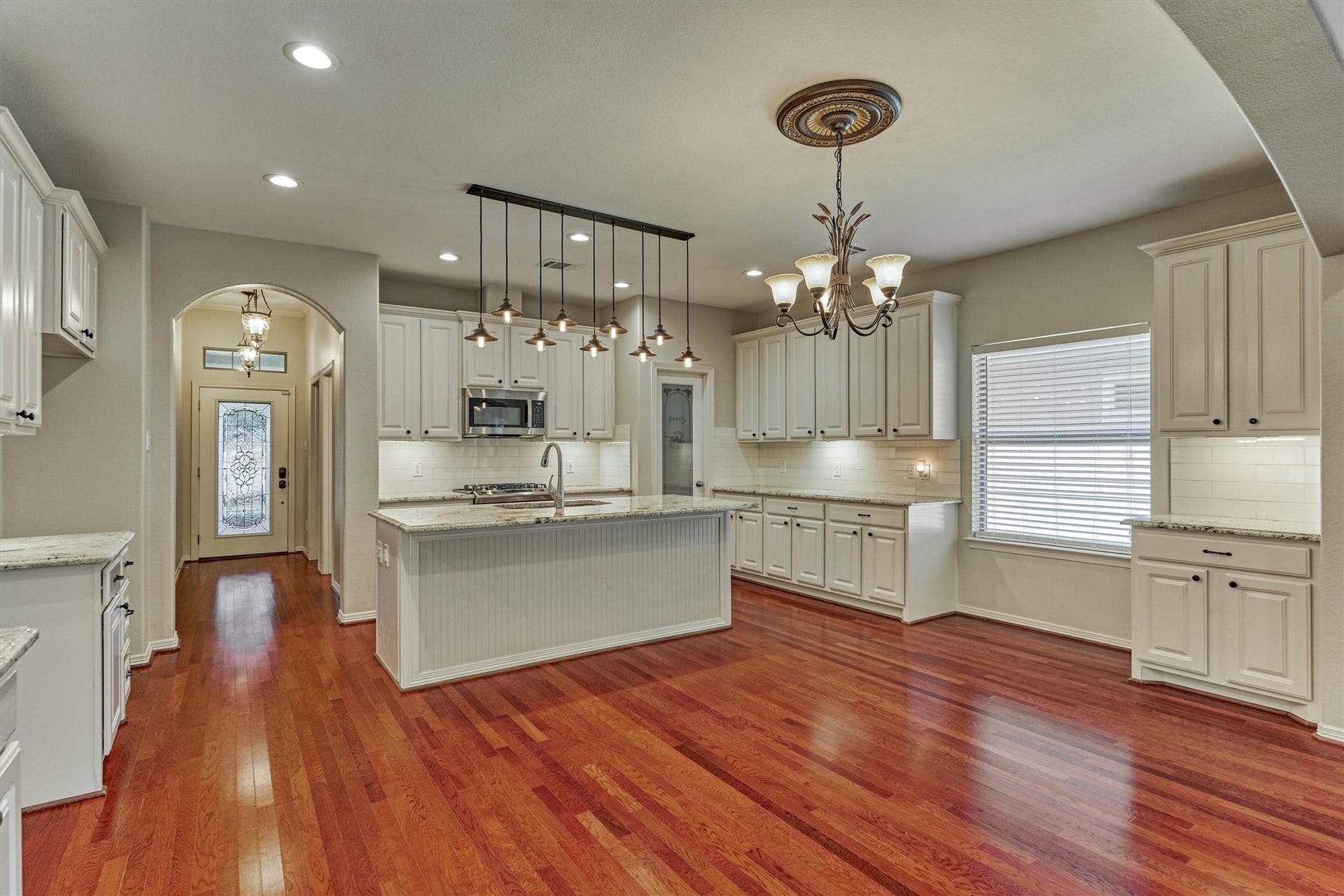 1794 Canyon Lake Creek Drive, Conroe, TX 77304 The center island with decorative lighting provides additional seating and counter space.