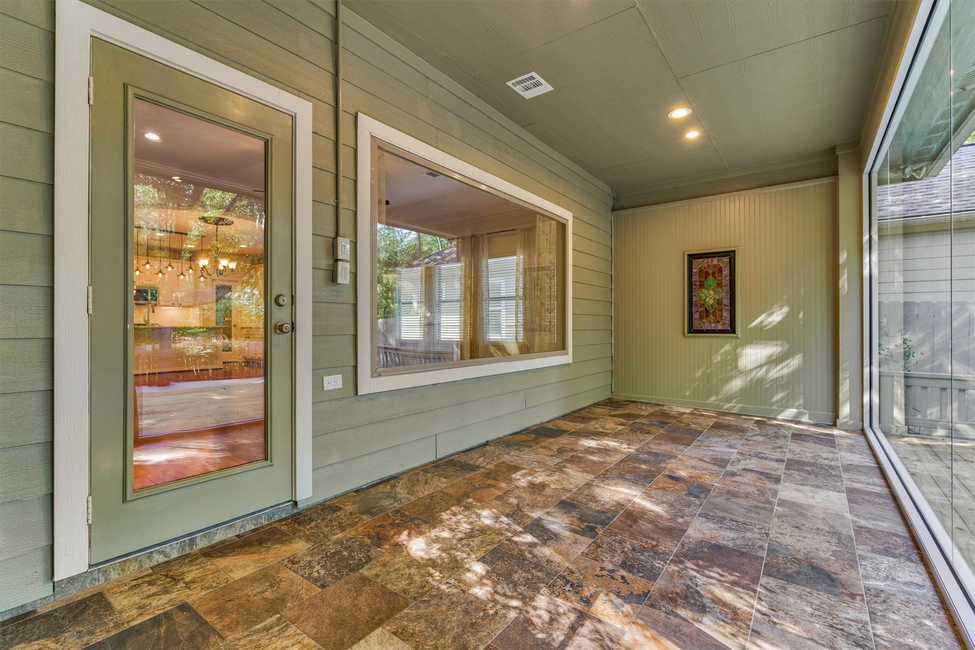 1794 Canyon Lake Creek Drive, Conroe, TX 77304 Off of the living room and primary bedroom is a beautiful sunroom!