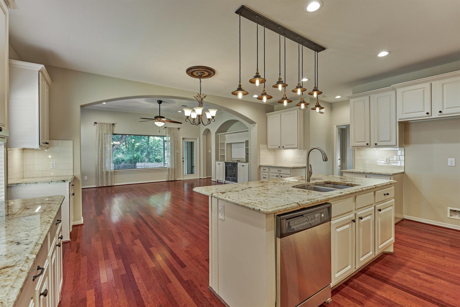 1794 Canyon Lake Creek Drive, Conroe, TX 77304 A look back to the dining and living rooms from the kitchen. The open concept floor plan is great for entertaining!