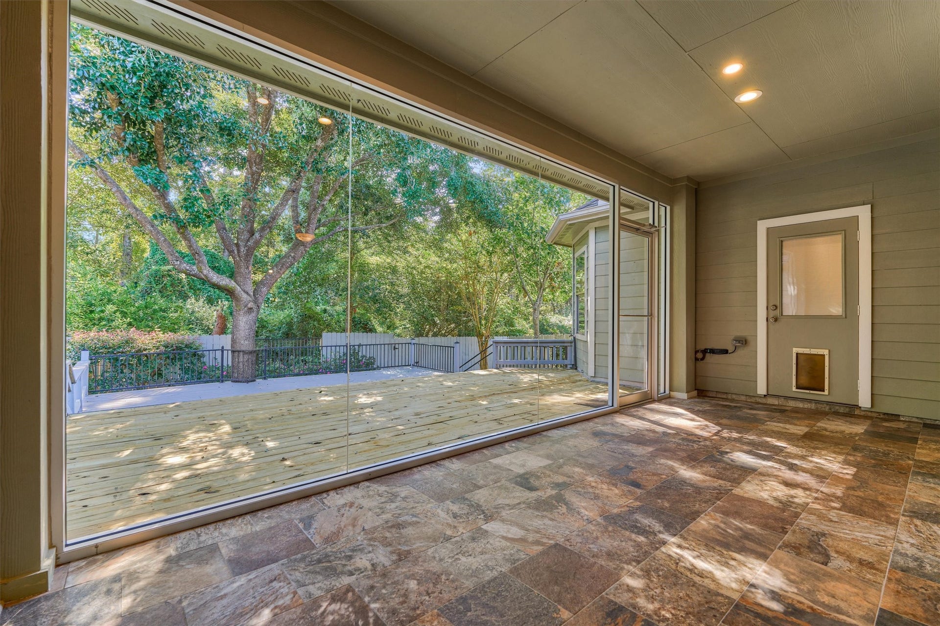 1794 Canyon Lake Creek Drive, Conroe, TX 77304 Seamless glass windows overlook the shaded and serene backyard!