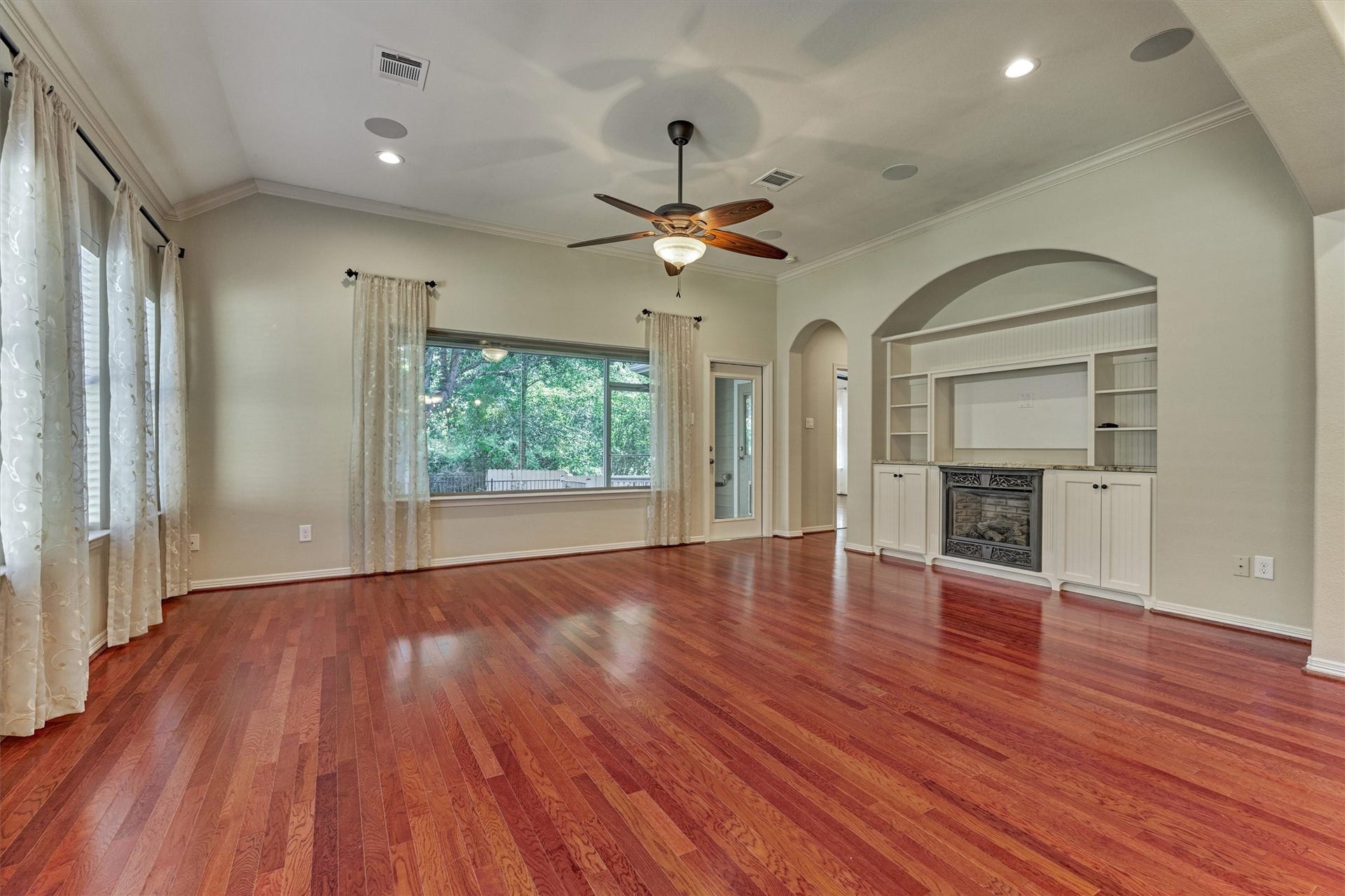 1794 Canyon Lake Creek Drive, Conroe, TX 77304 Built-ins and electric fireplace are the focal point of this room.