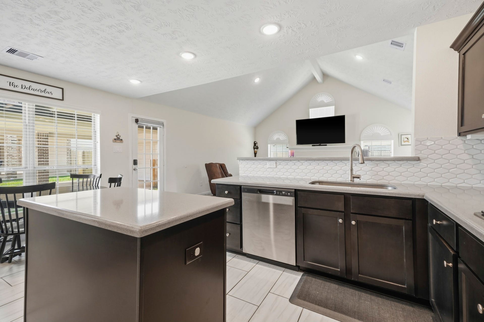 2102 Wikiup Street, Dickinson, TX 77539 Kitchen, featuring side door access and island.