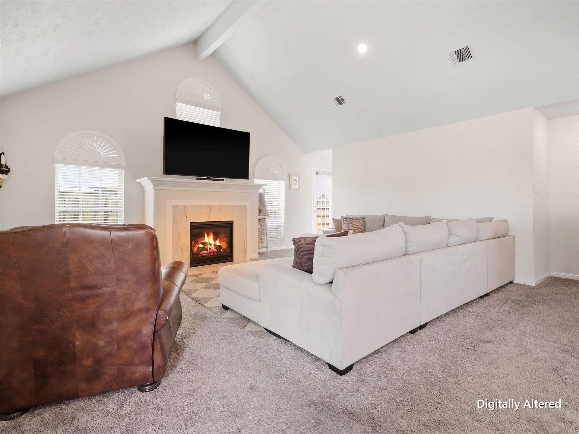 2102 Wikiup Street, Dickinson, TX 77539 Living area with vaulted ceilings, custom blinds and illuminated fireplace. Digitally enhanced for visual clarity; decor and visual clutter removed only.