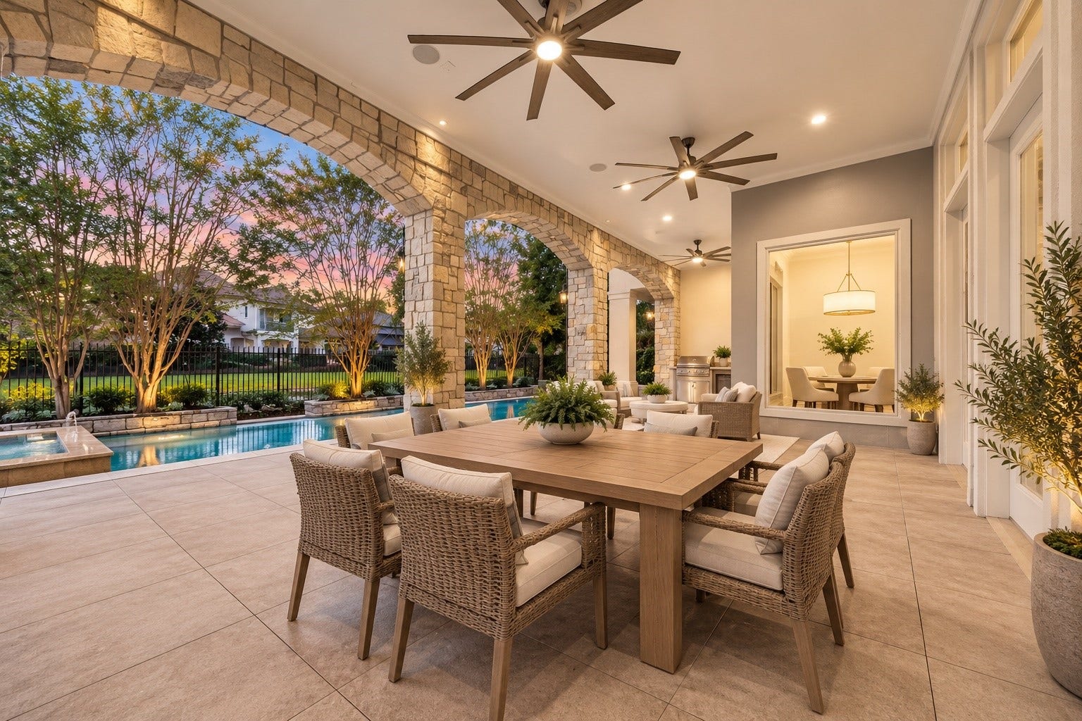 Extend your living space outdoors to this expansive covered patio, where elegant stone arches, soaring ceilings, and generous seating areas create the perfect setting for entertaining! With a built in outdoor kitchen, refreshing pool views, and plenty of room to gather, every evening here feels like a luxury getaway in the comfort of home. *Virtually Staged
